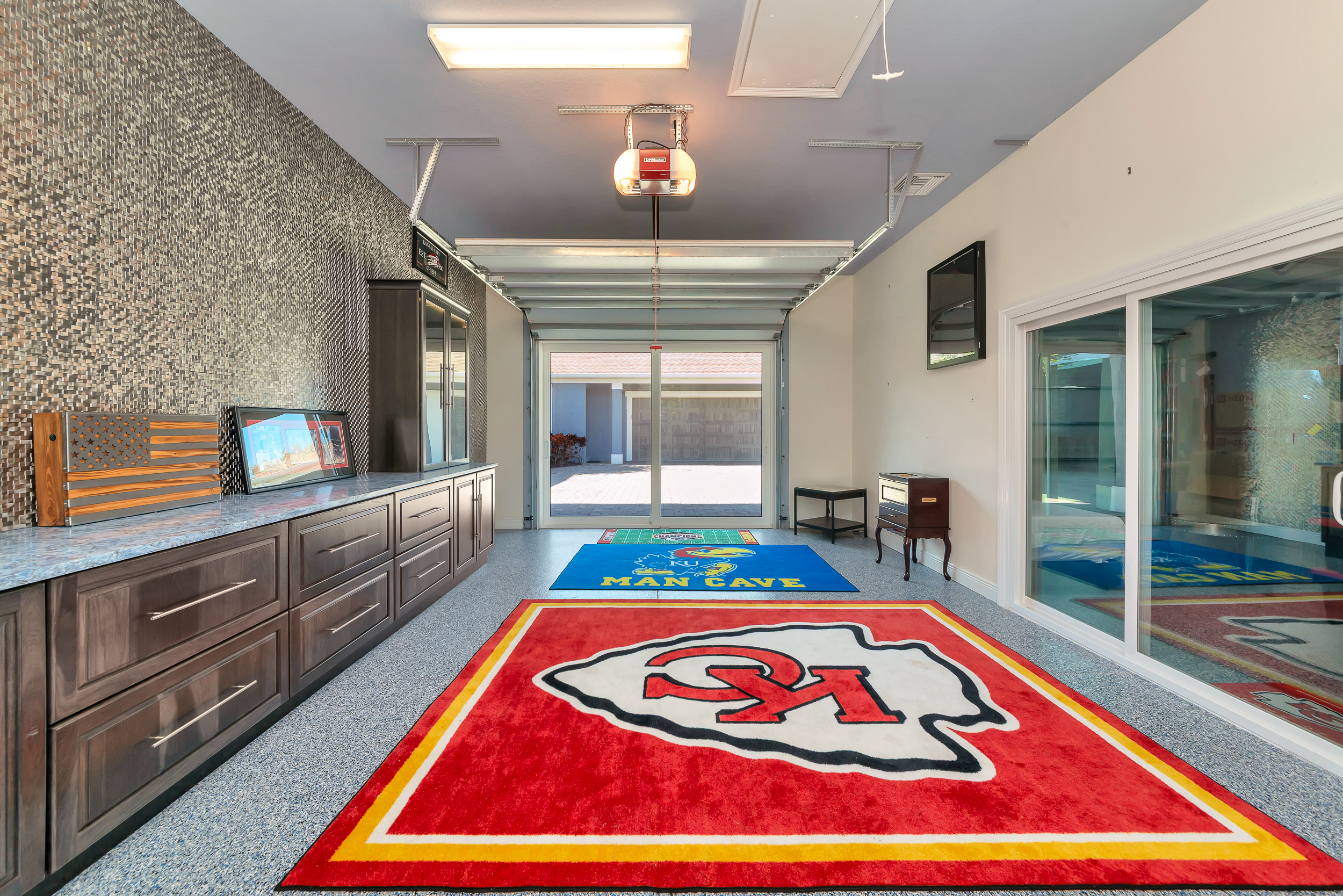 Finished flex garage space in the third building with epoxy floors and built-in cabinetry
