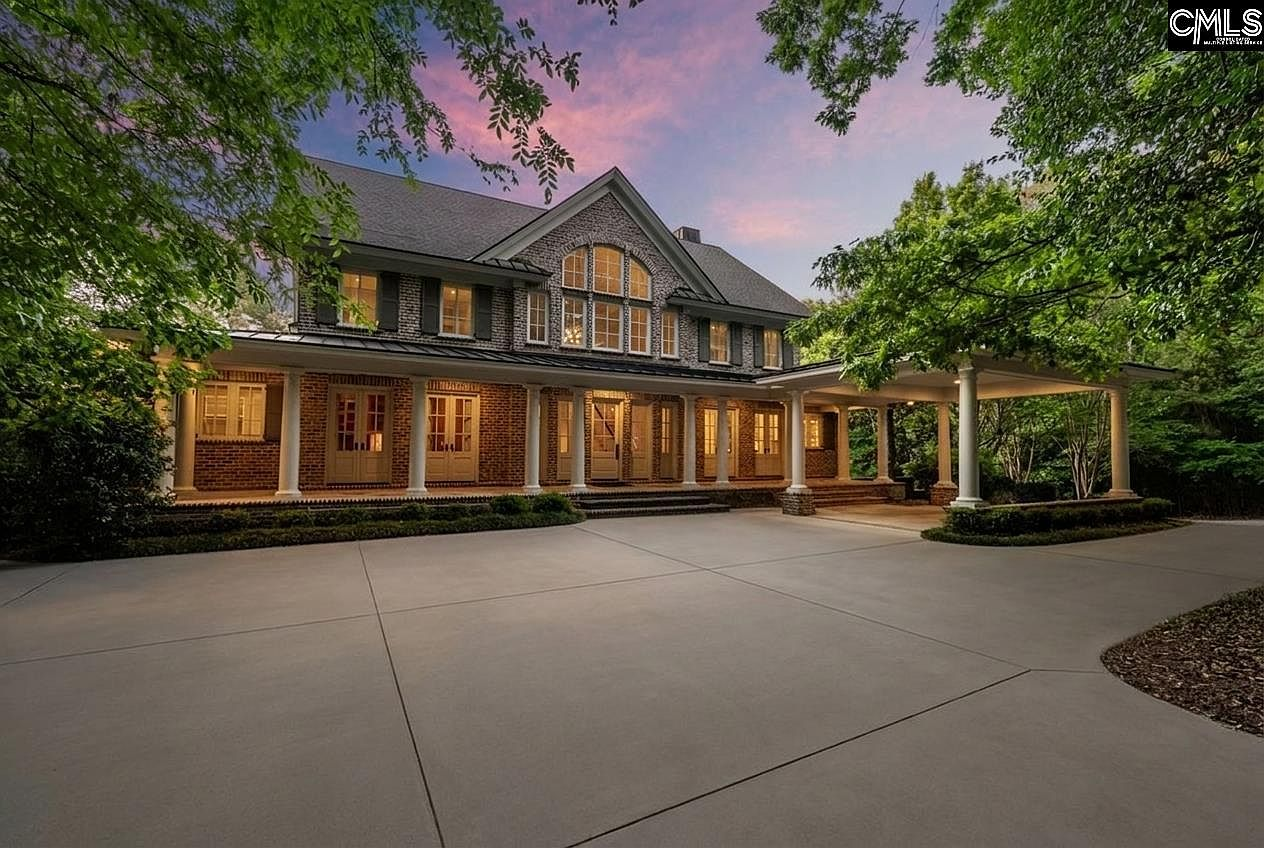 Front exterior of lowcountry brick estate at 664 River Rd, Columbia SC