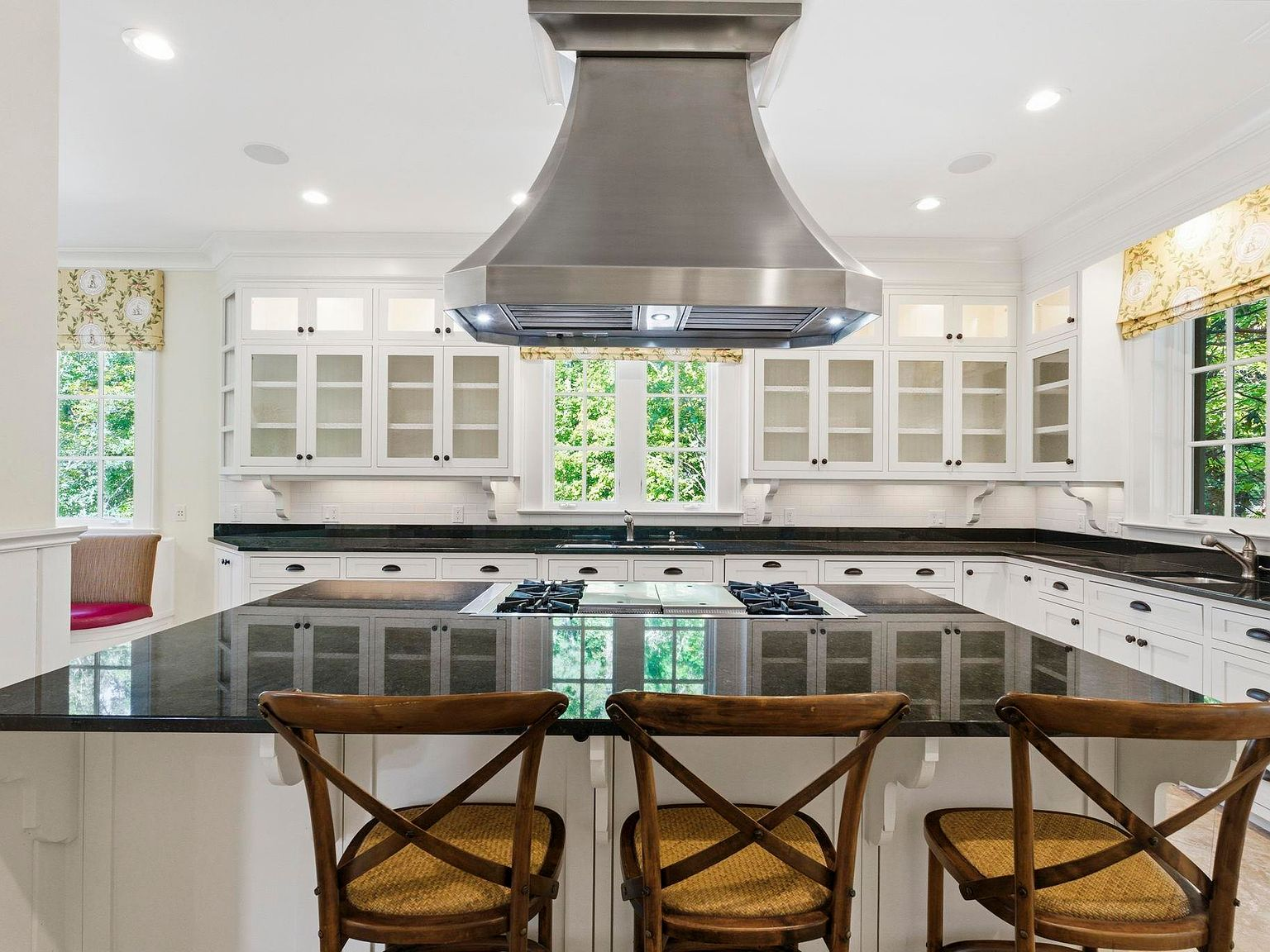 Gourmet kitchen with island and custom cabinetry