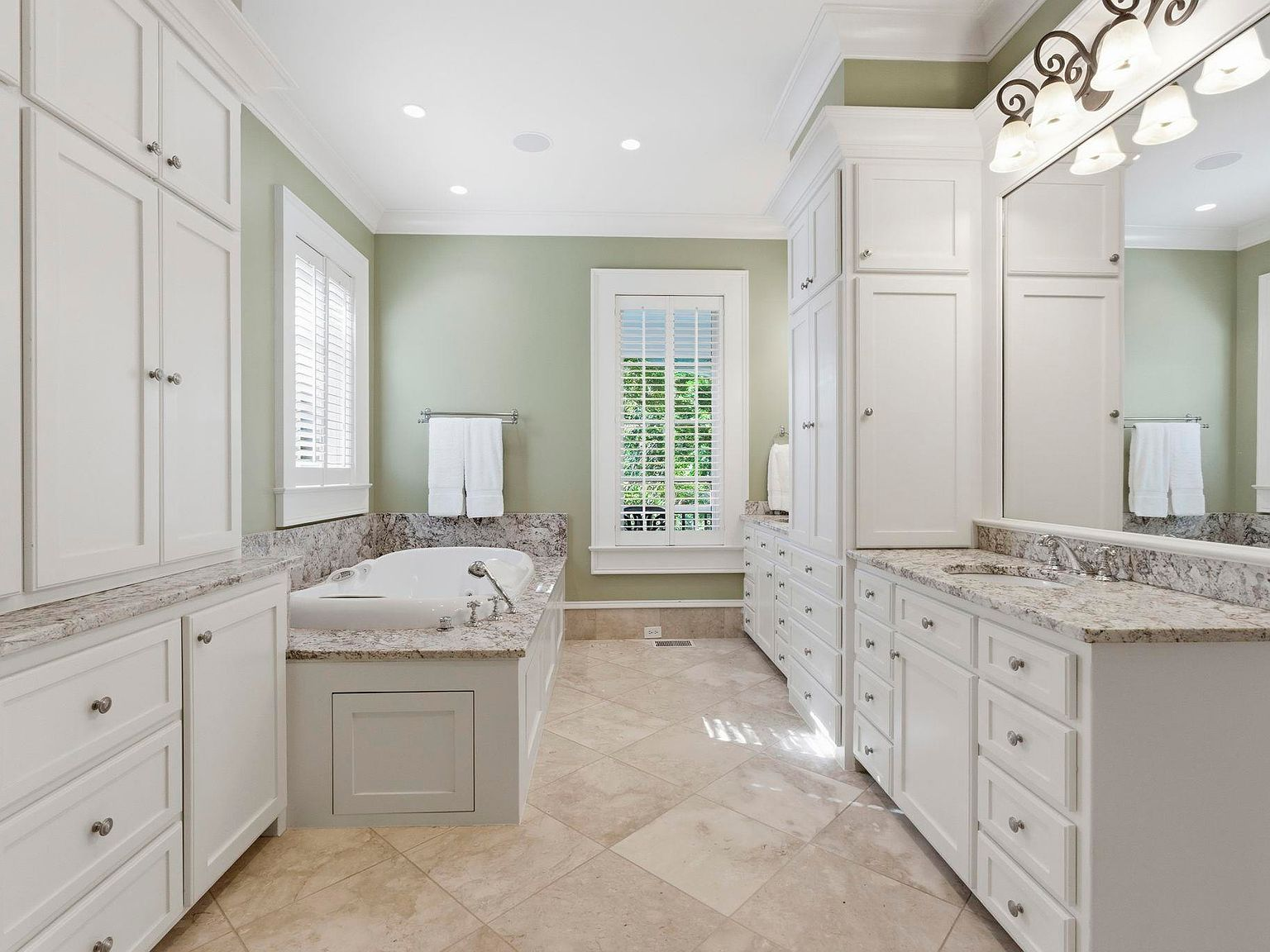Master bathroom suite with double vanity and granite countertops