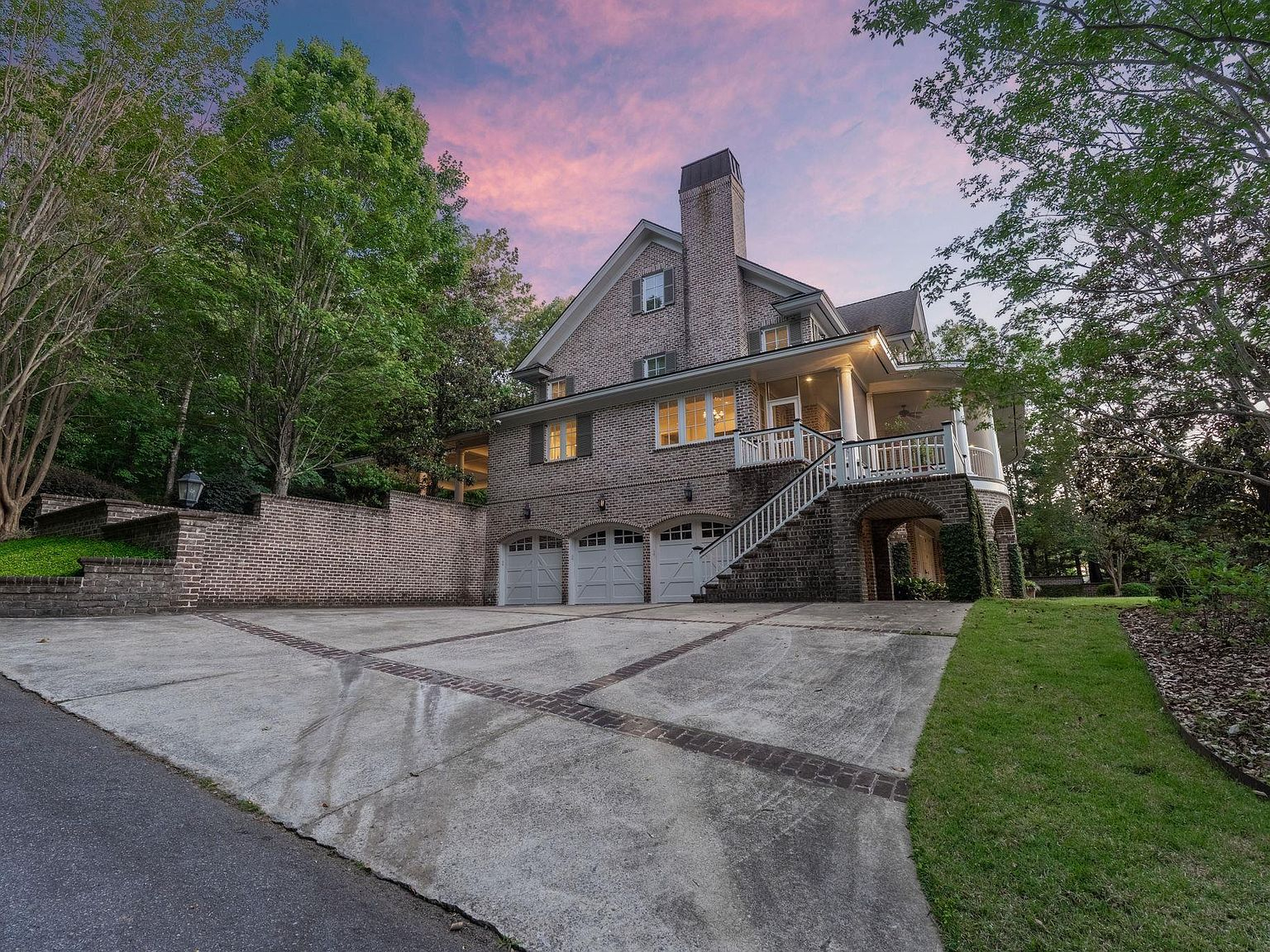 664 River Rd luxury brick facade at sunset