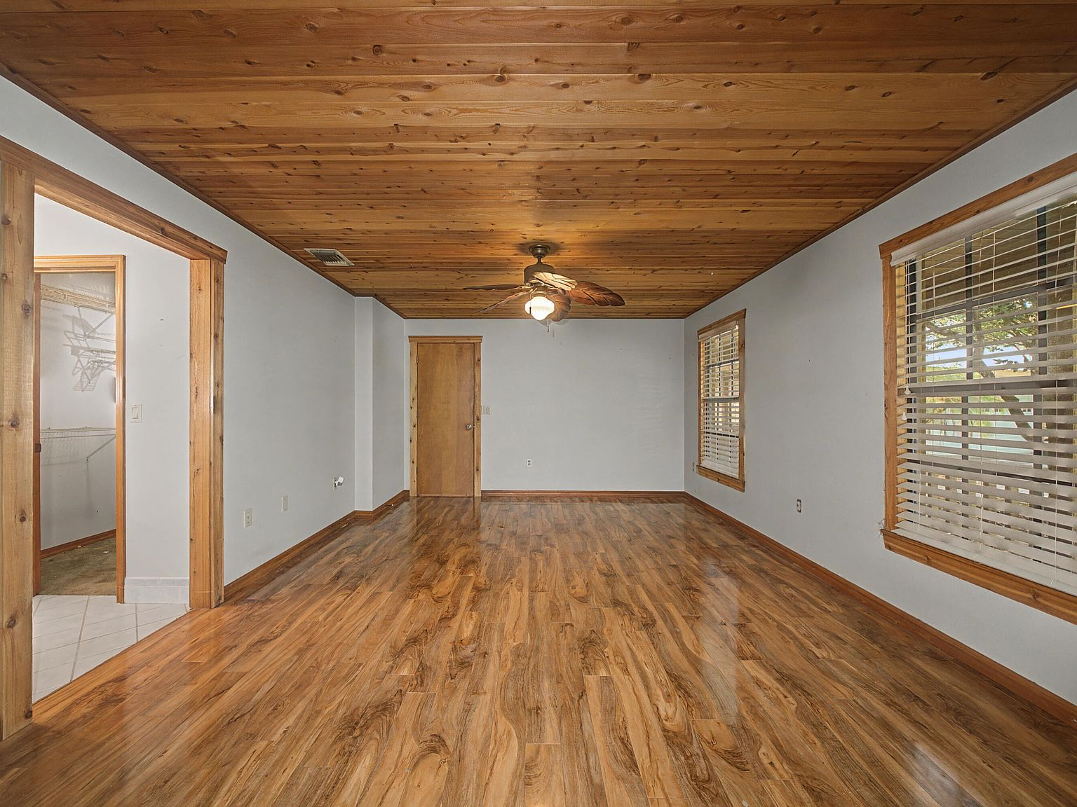 Primary bedroom with wood plank ceiling
