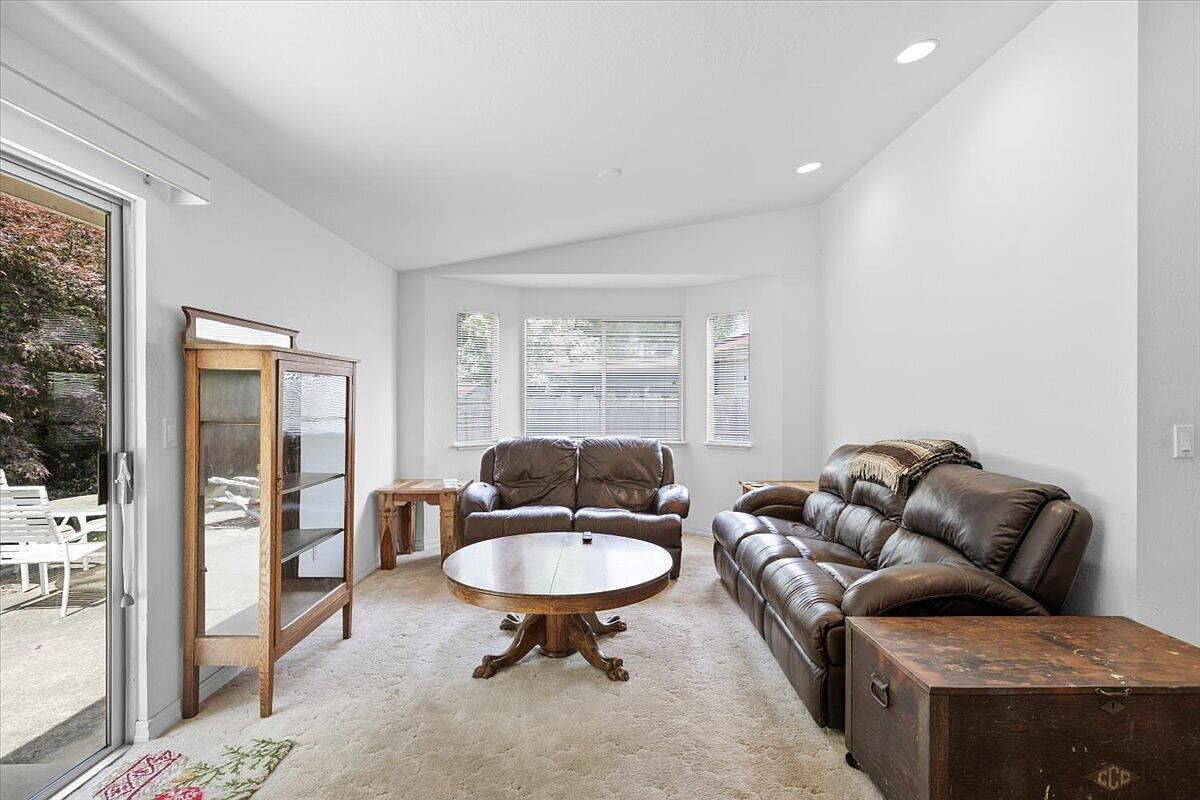 Spacious living room with bay window and vaulted ceiling