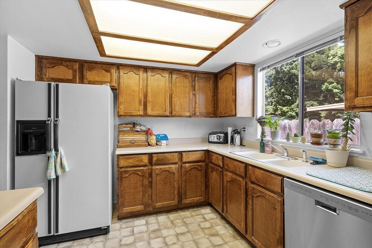 Kitchen with oak cabinets and laminate countertops