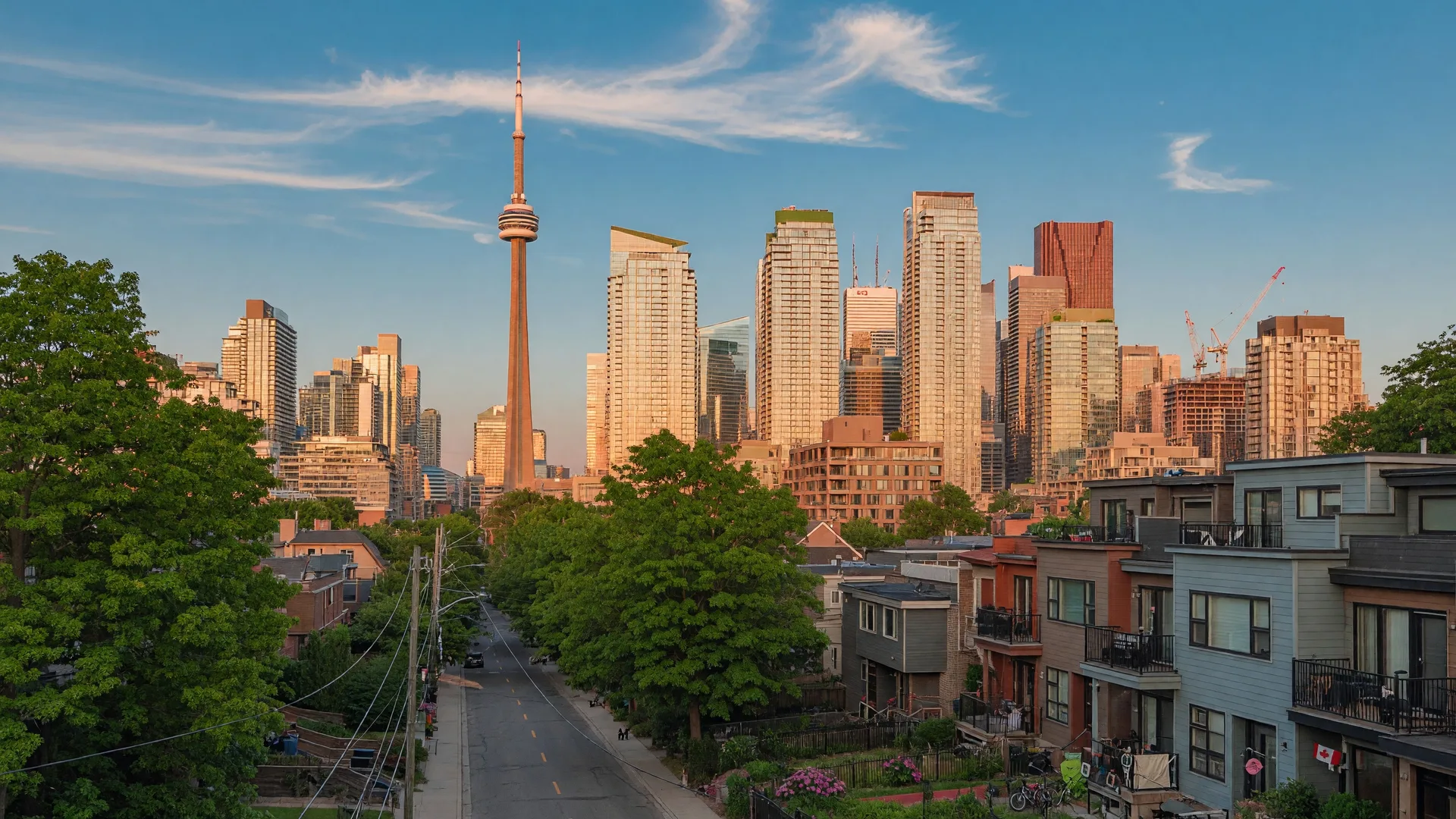 Toronto skyline viewed from the west end on a clear summer afternoon with residential townhouses in the foreground