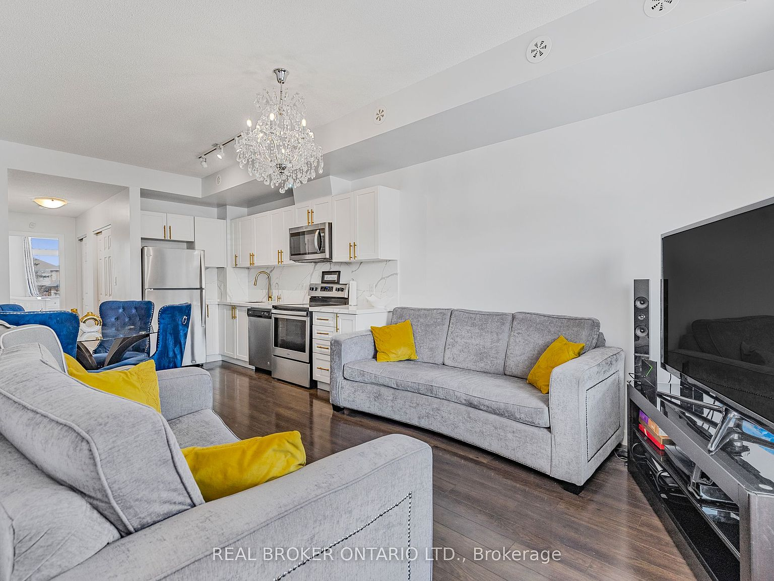 Open-concept living room and kitchen with modern finishes