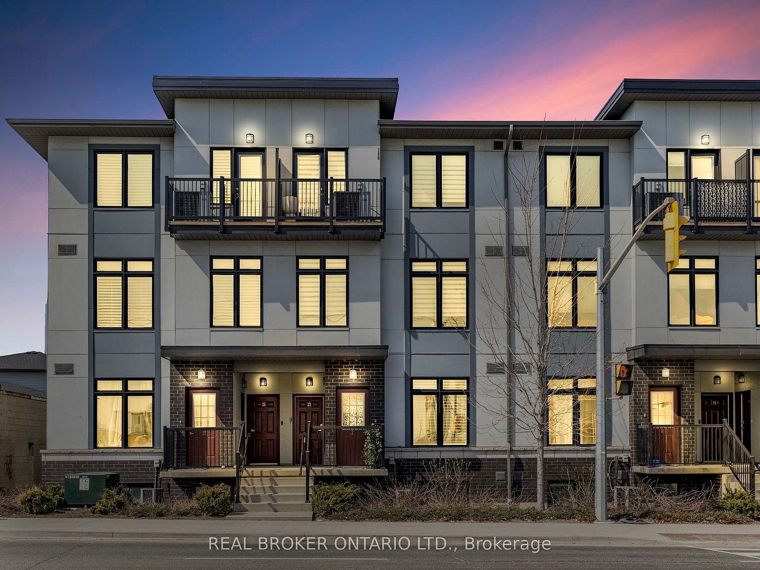 Modern townhouse exterior at 630 Rogers Rd #21, Toronto, at twilight