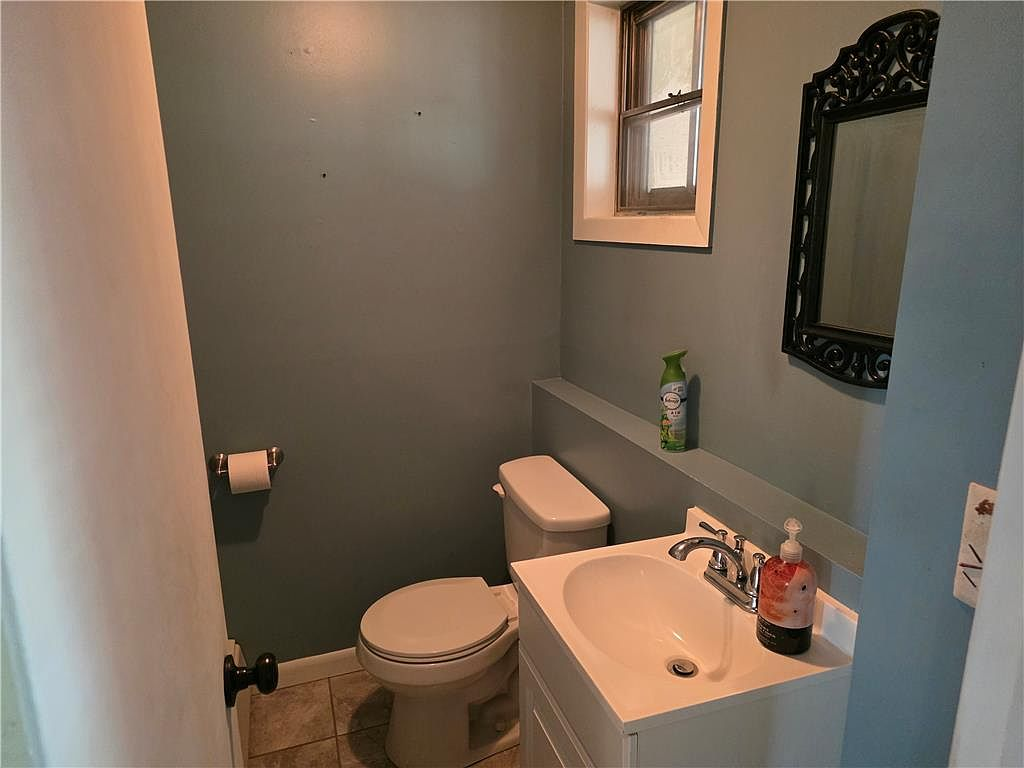 Half bathroom with blue walls