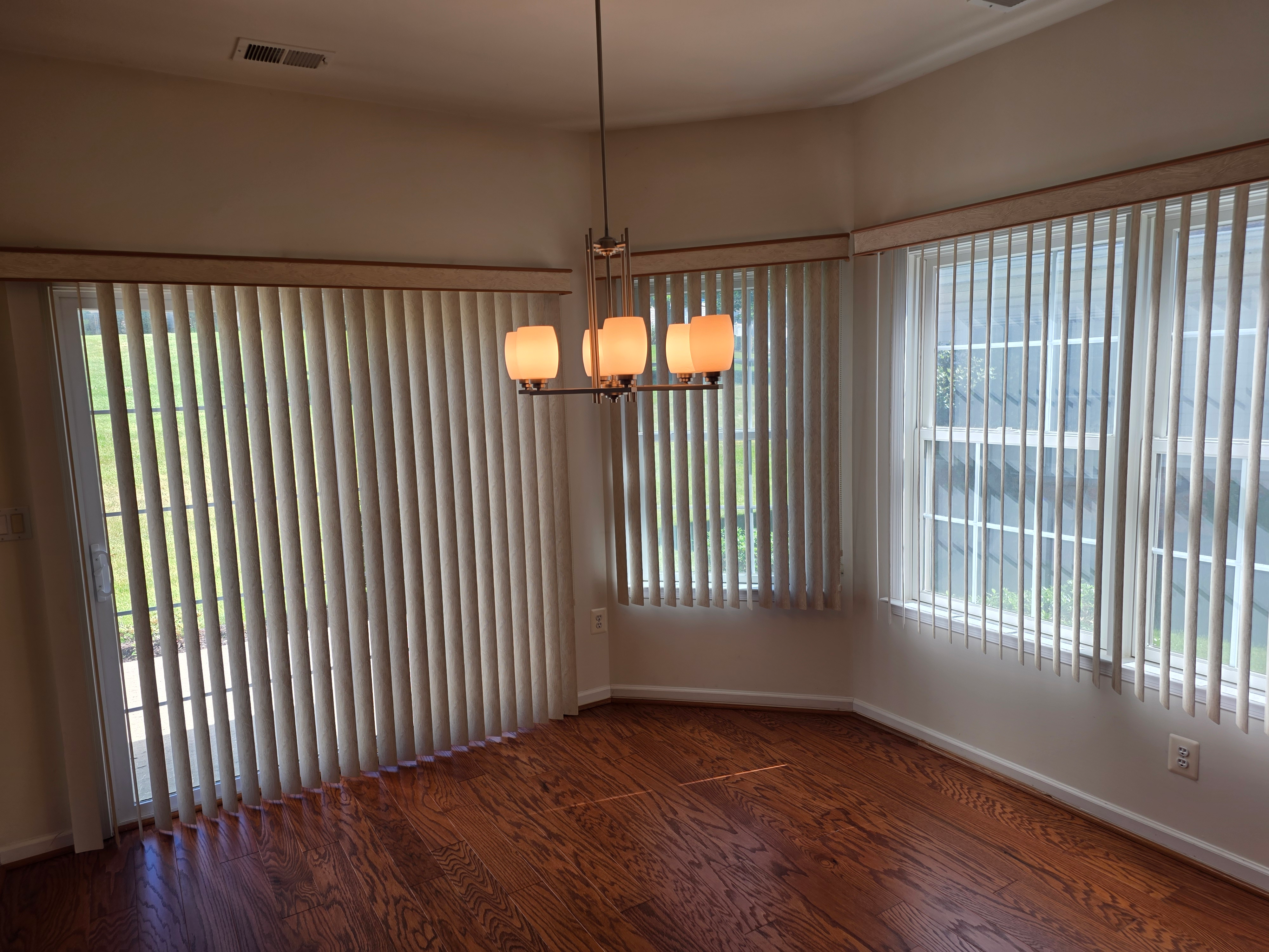 Dining or sunroom area with hardwood flooring