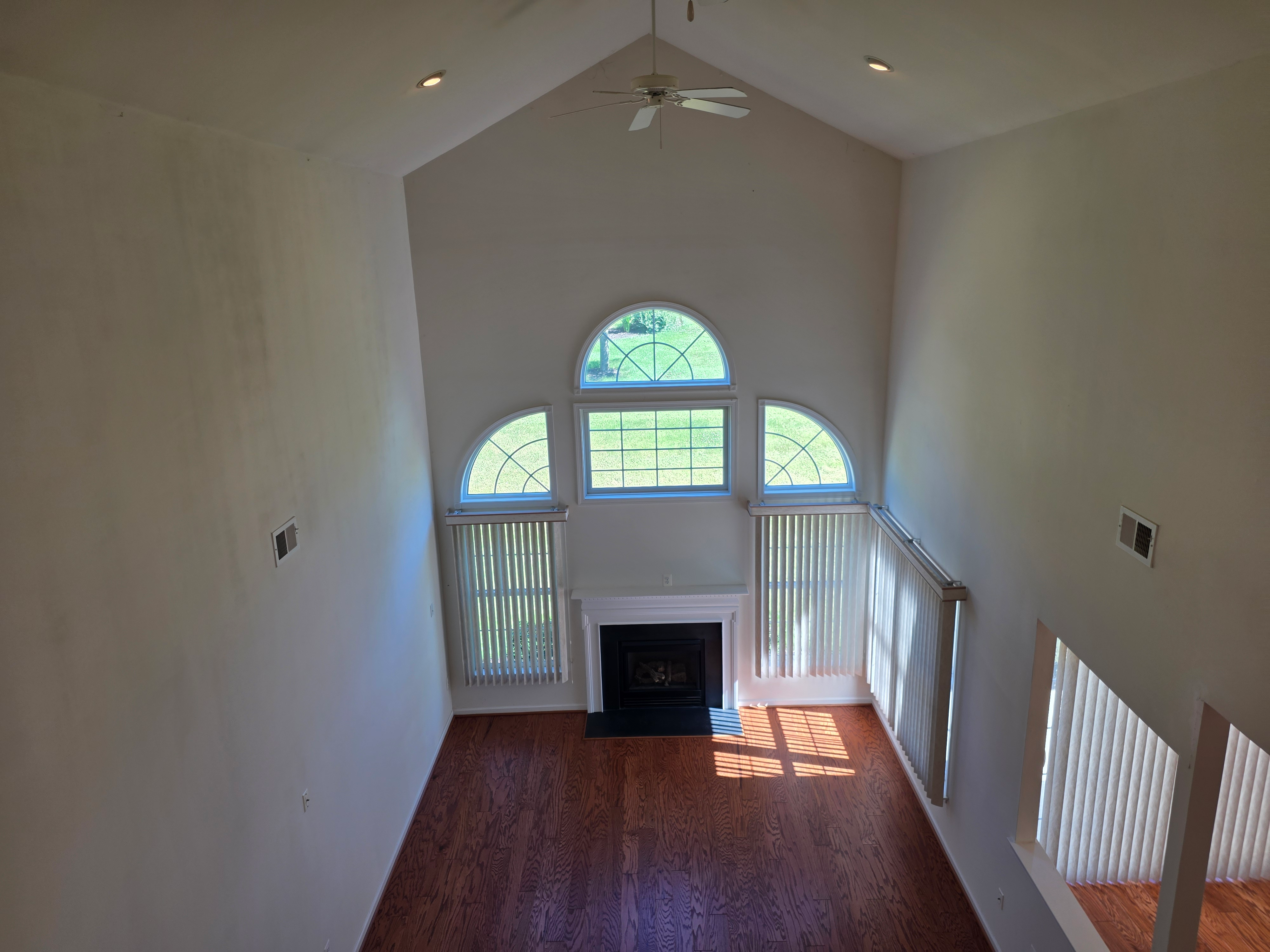 Elevated view looking down into living room with fireplace