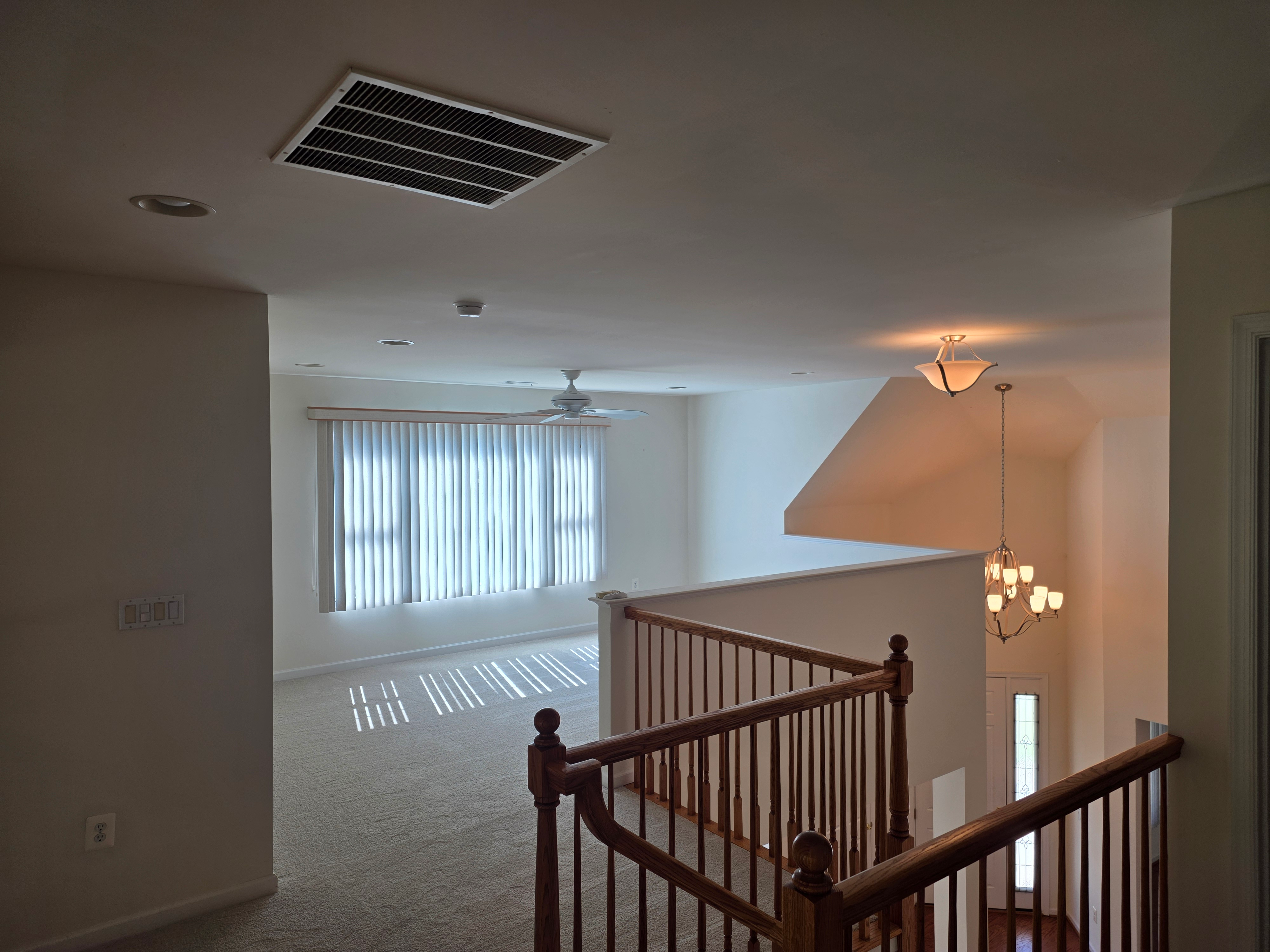 Upper-level loft overlooking entry foyer
