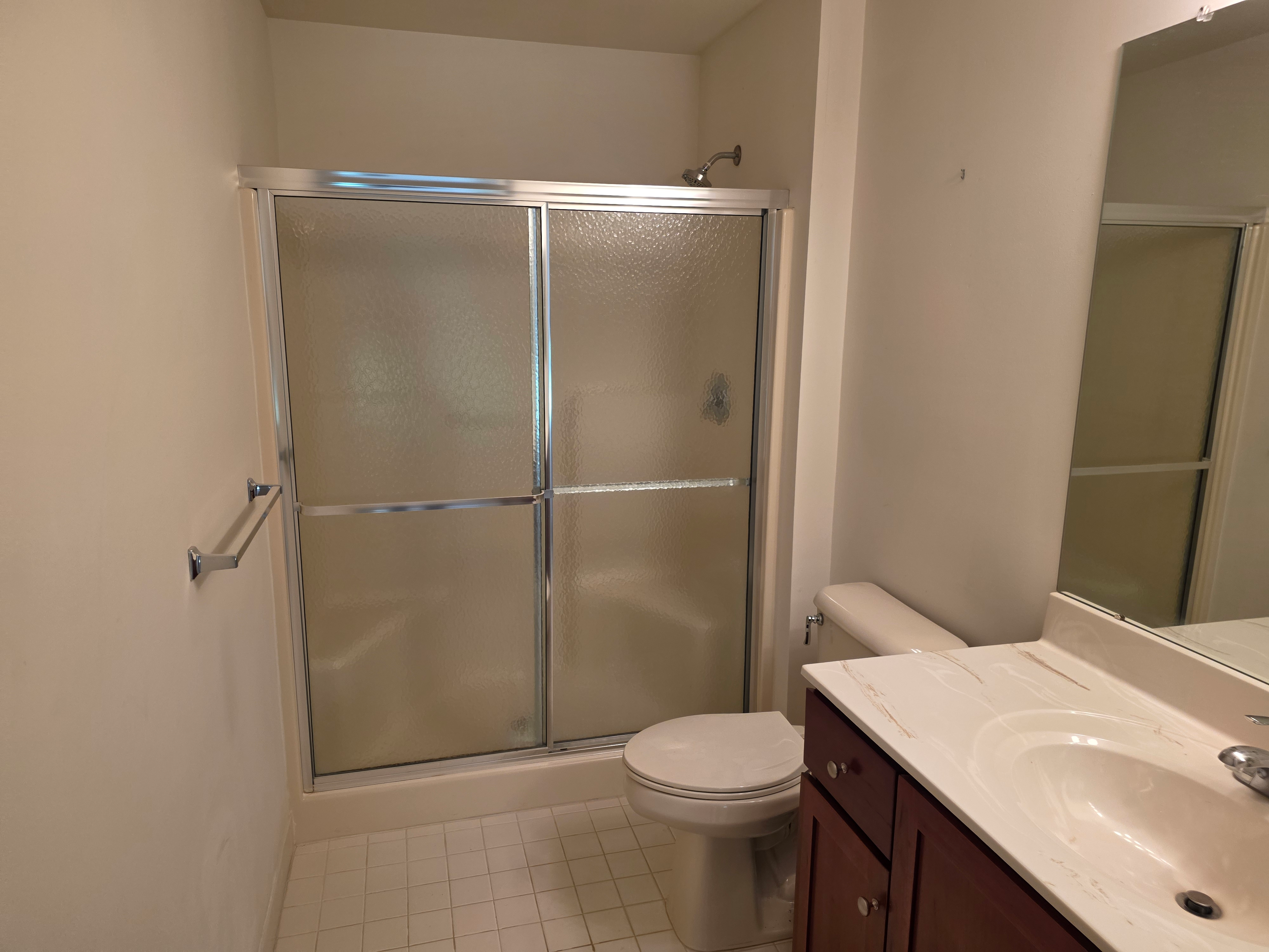 Bathroom with glass-enclosed walk-in shower