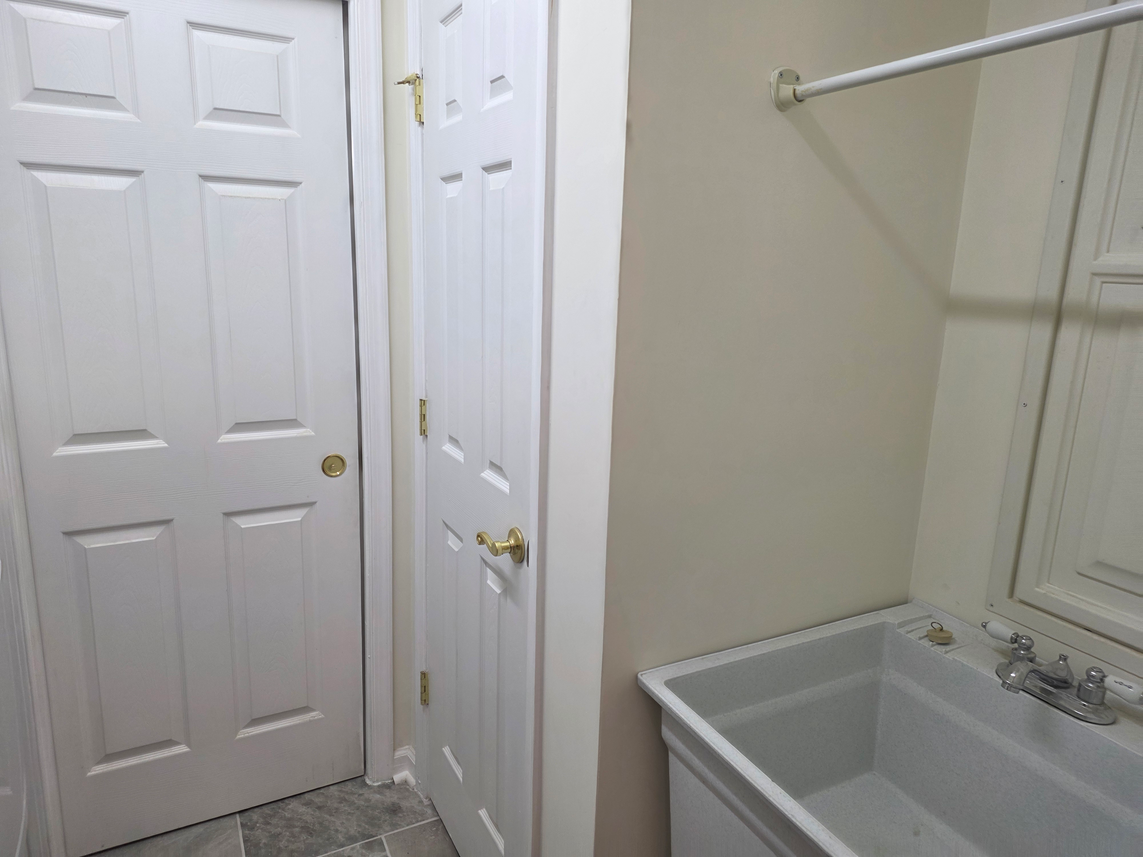 Bathroom tub area with chrome fixtures