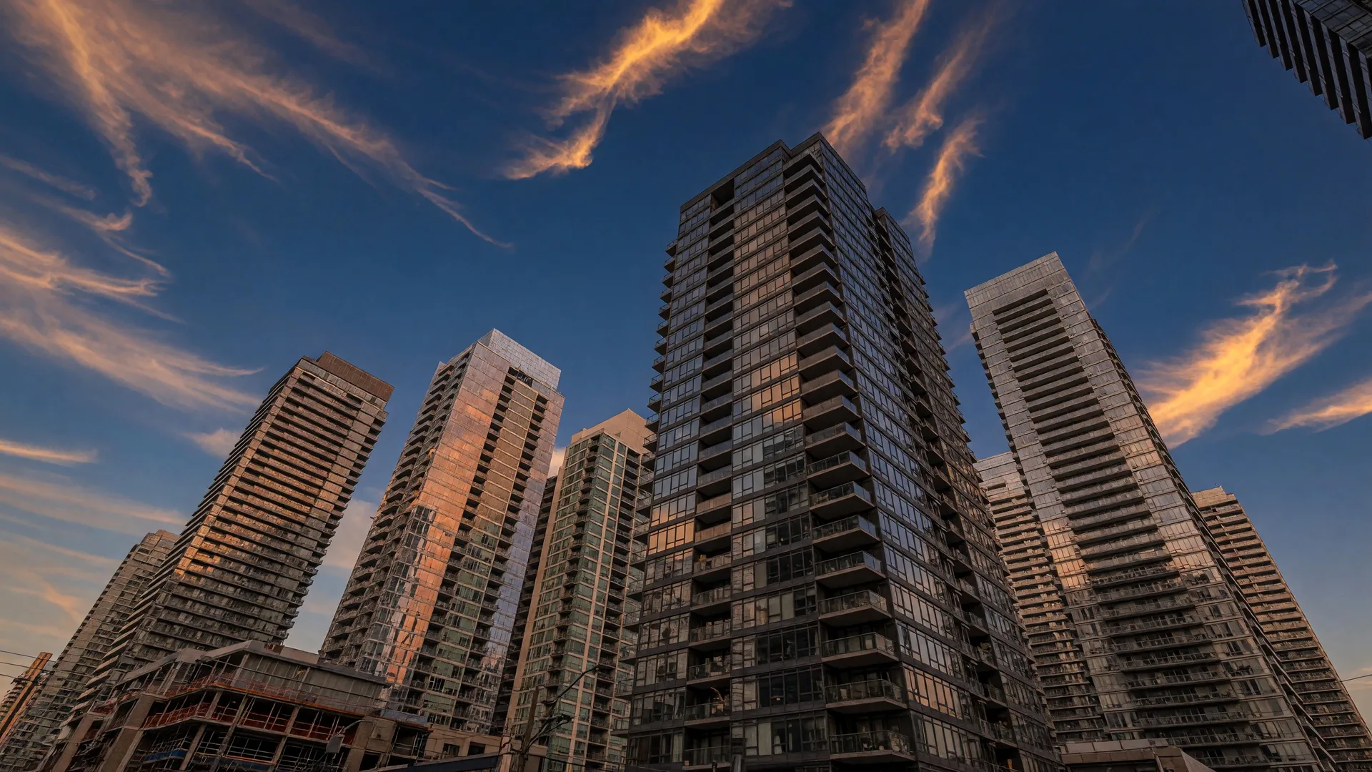 Modern downtown Toronto condo towers at golden hour — the condo market is showing signs of a strong recovery