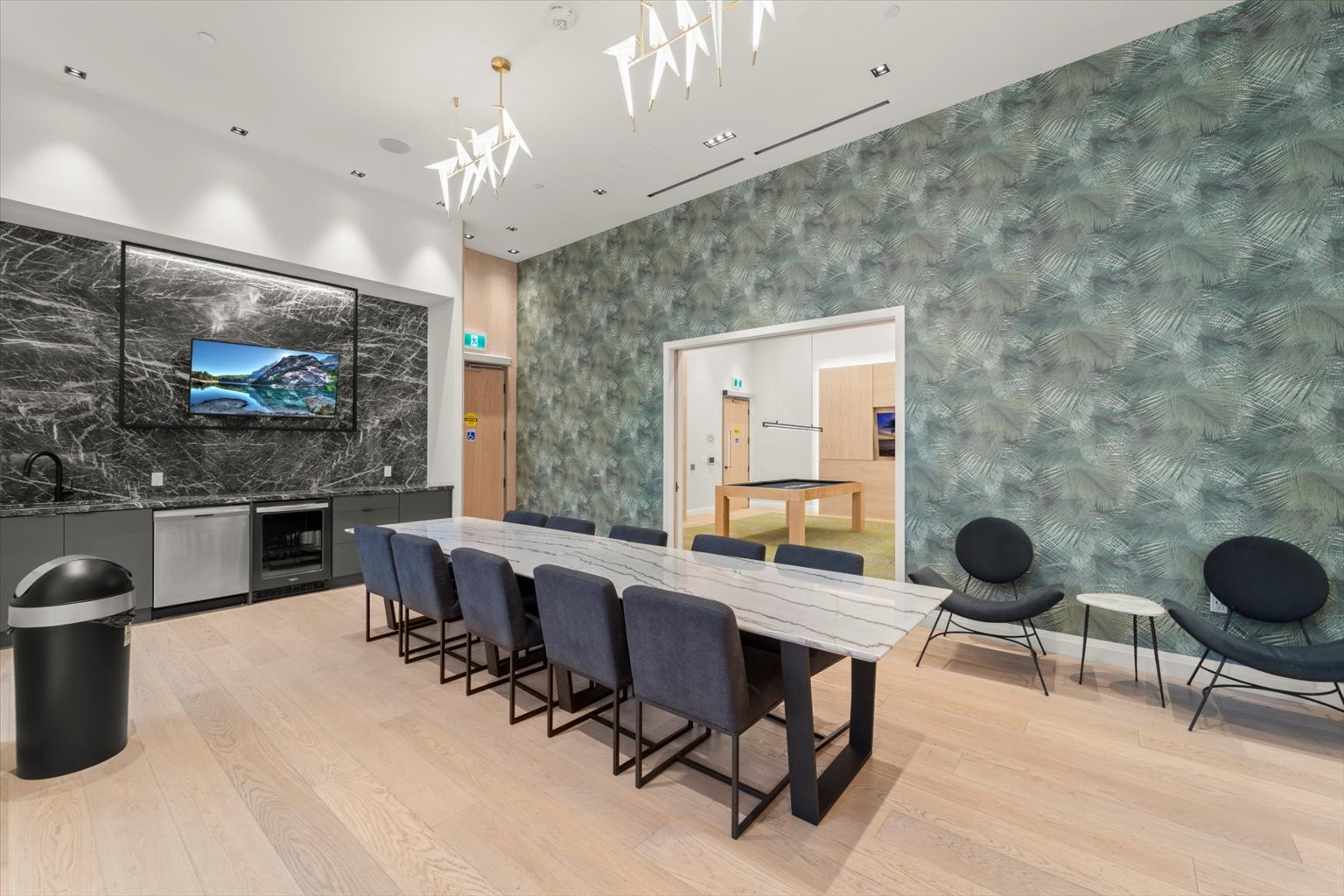 Dining lounge with botanical feature wall and marble accent