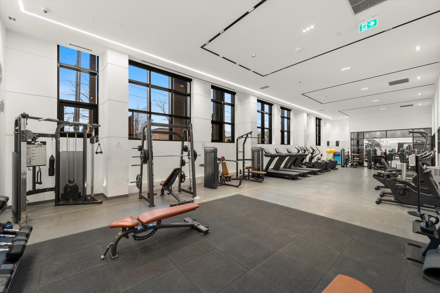 Fully equipped building fitness center with treadmills and weight machines