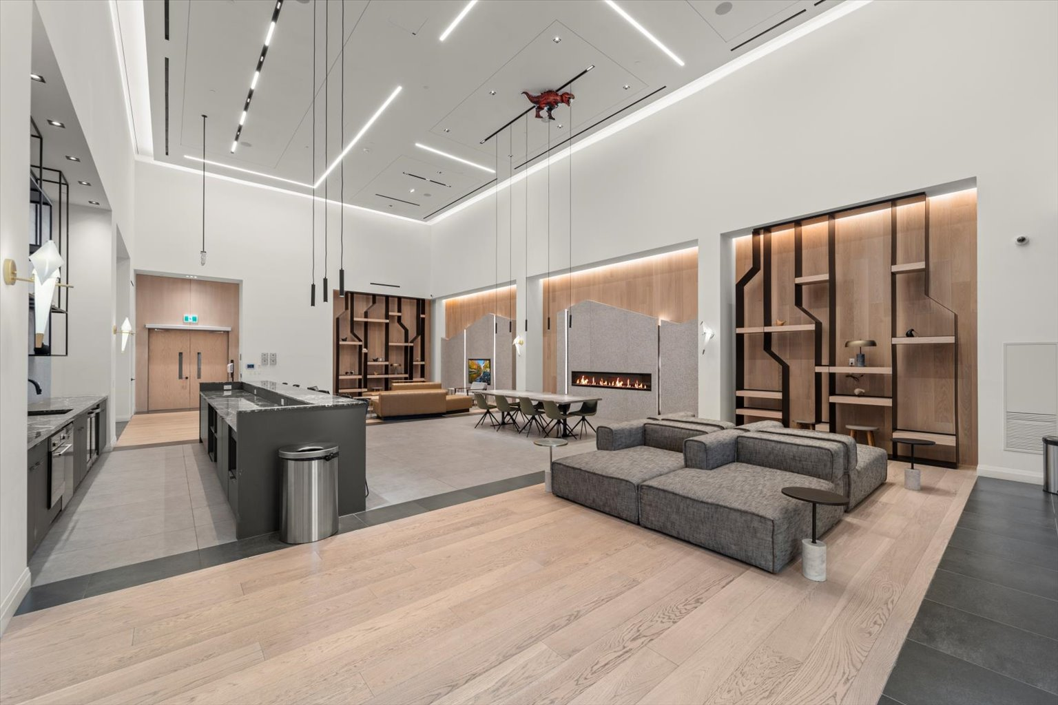 Multi-functional event lounge with modular sofas and high ceilings
