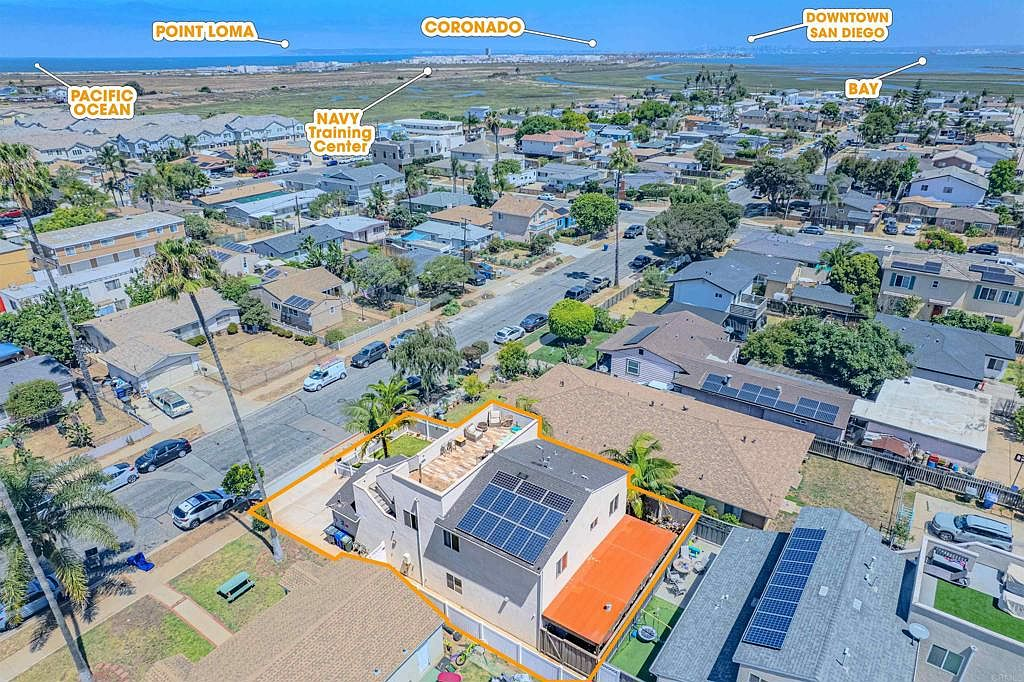 Aerial shot looking over property toward bay and ocean