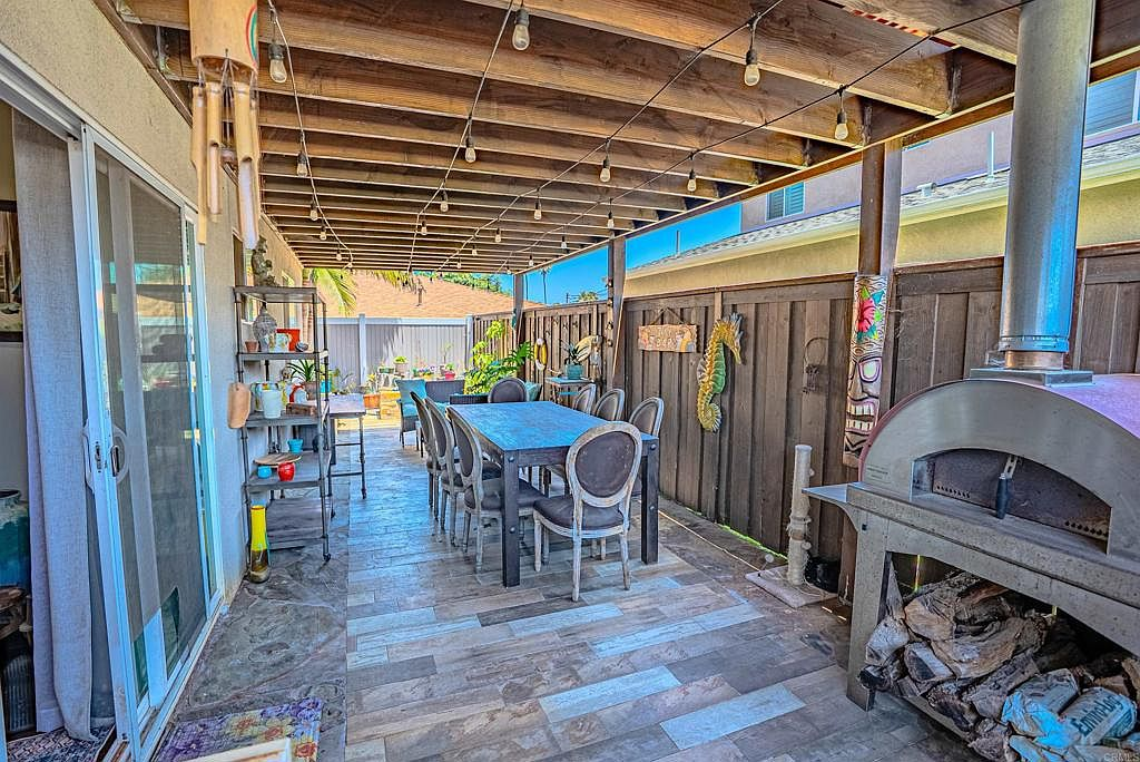 Backyard dining area under covered pergola