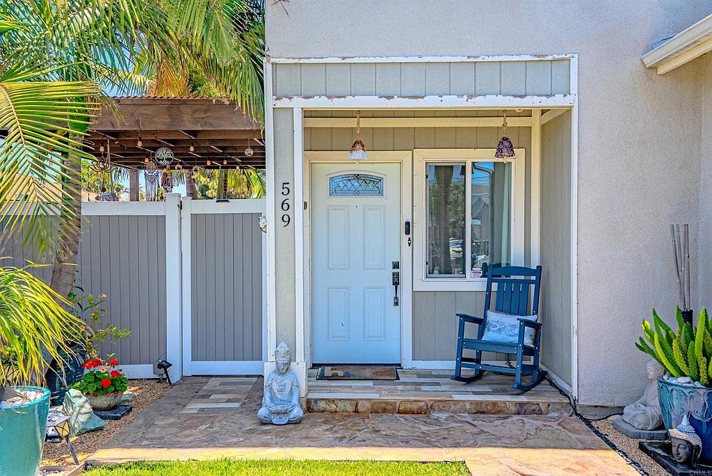 Front entryway with wood siding and trim details