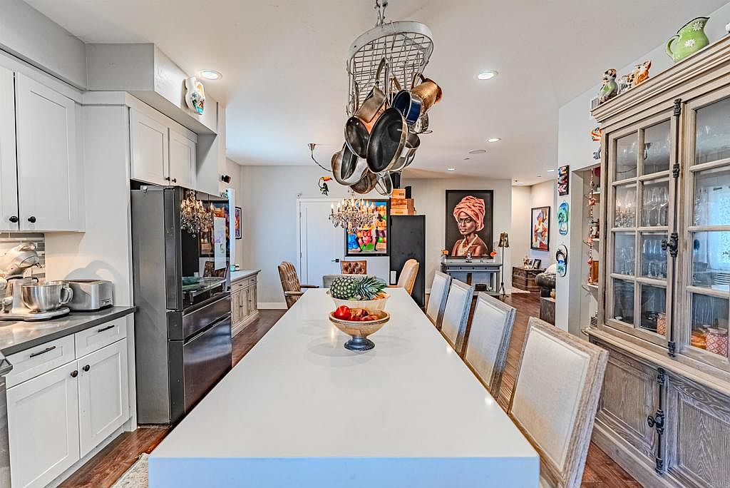 Kitchen view from behind island toward living space