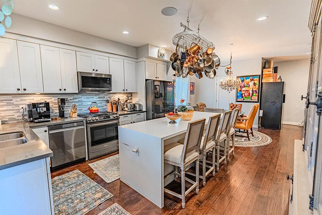 Kitchen and dining area with crystal chandelier