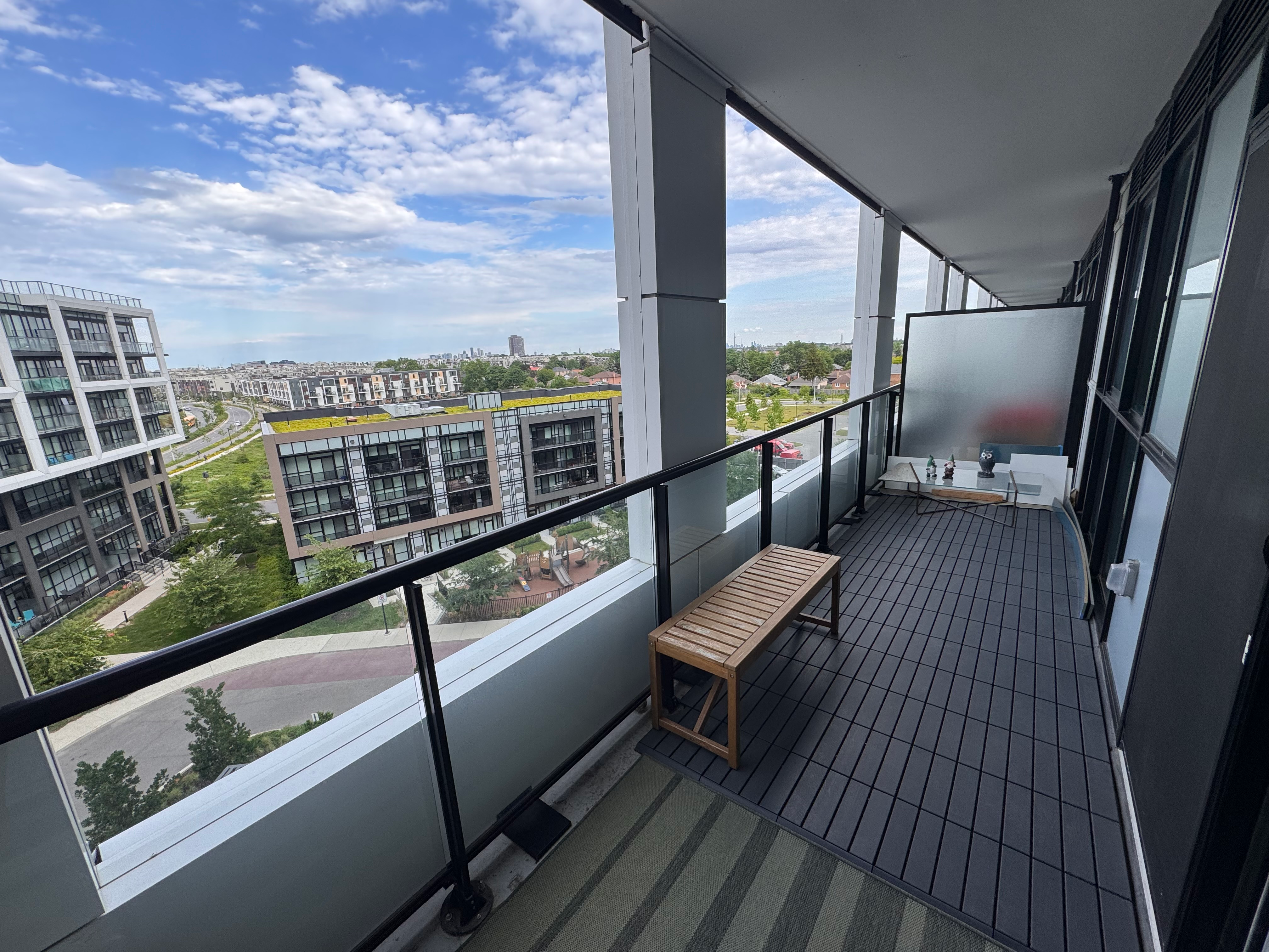 Balcony view from Unit 608 at 50 George Butchart Drive on a bright day
