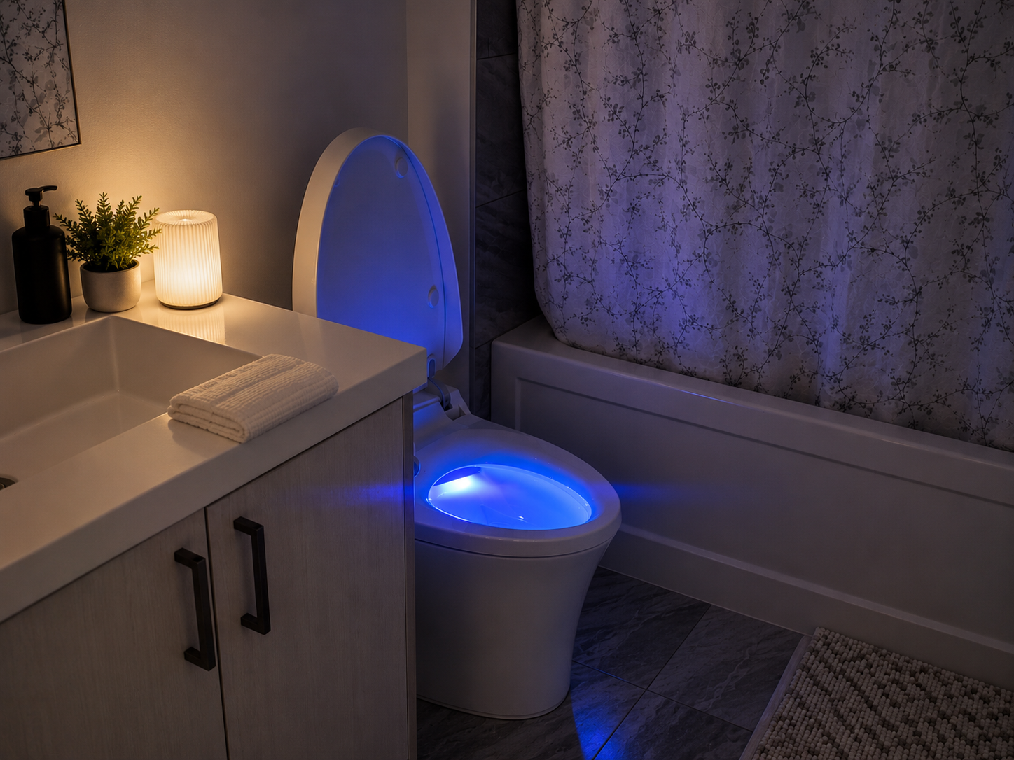Main bathroom at night with blue LED-lit smart toilet