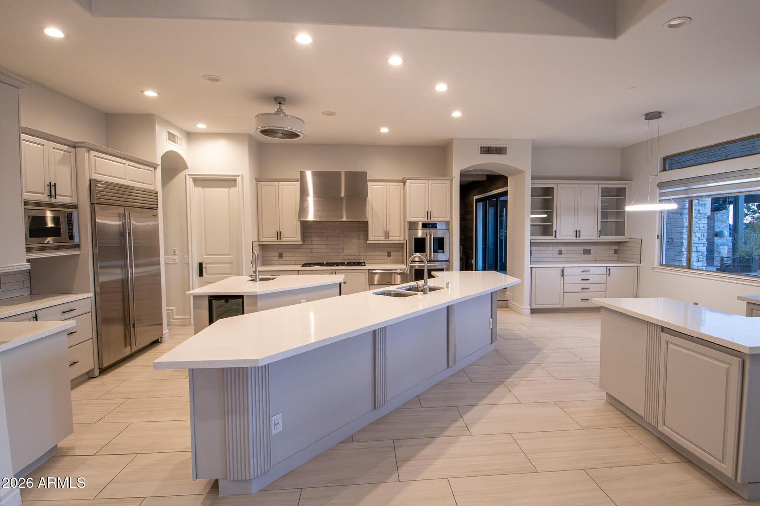 Gourmet kitchen with dual islands and professional appliances