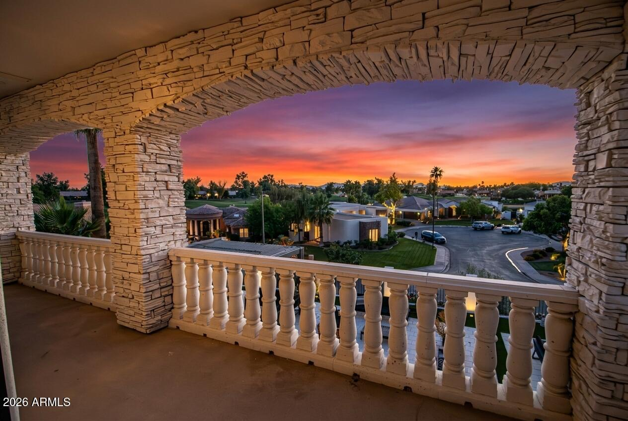 Stone balcony with stunning sunset views over the neighborhood