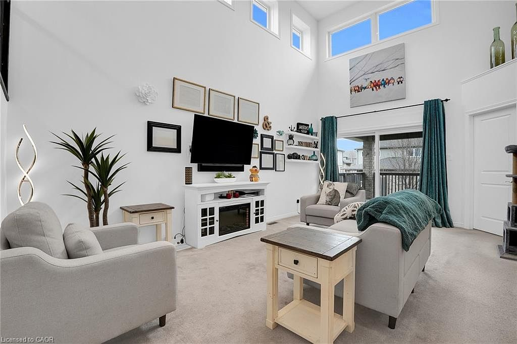 Living room with double-height ceilings and large windows