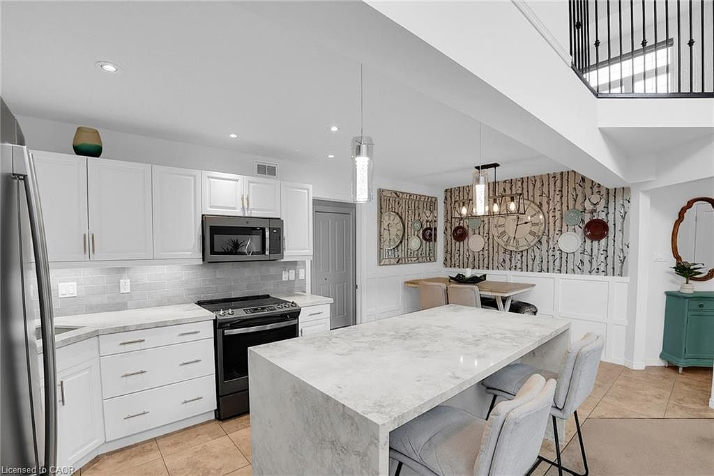 Modern kitchen with waterfall island and stone countertops