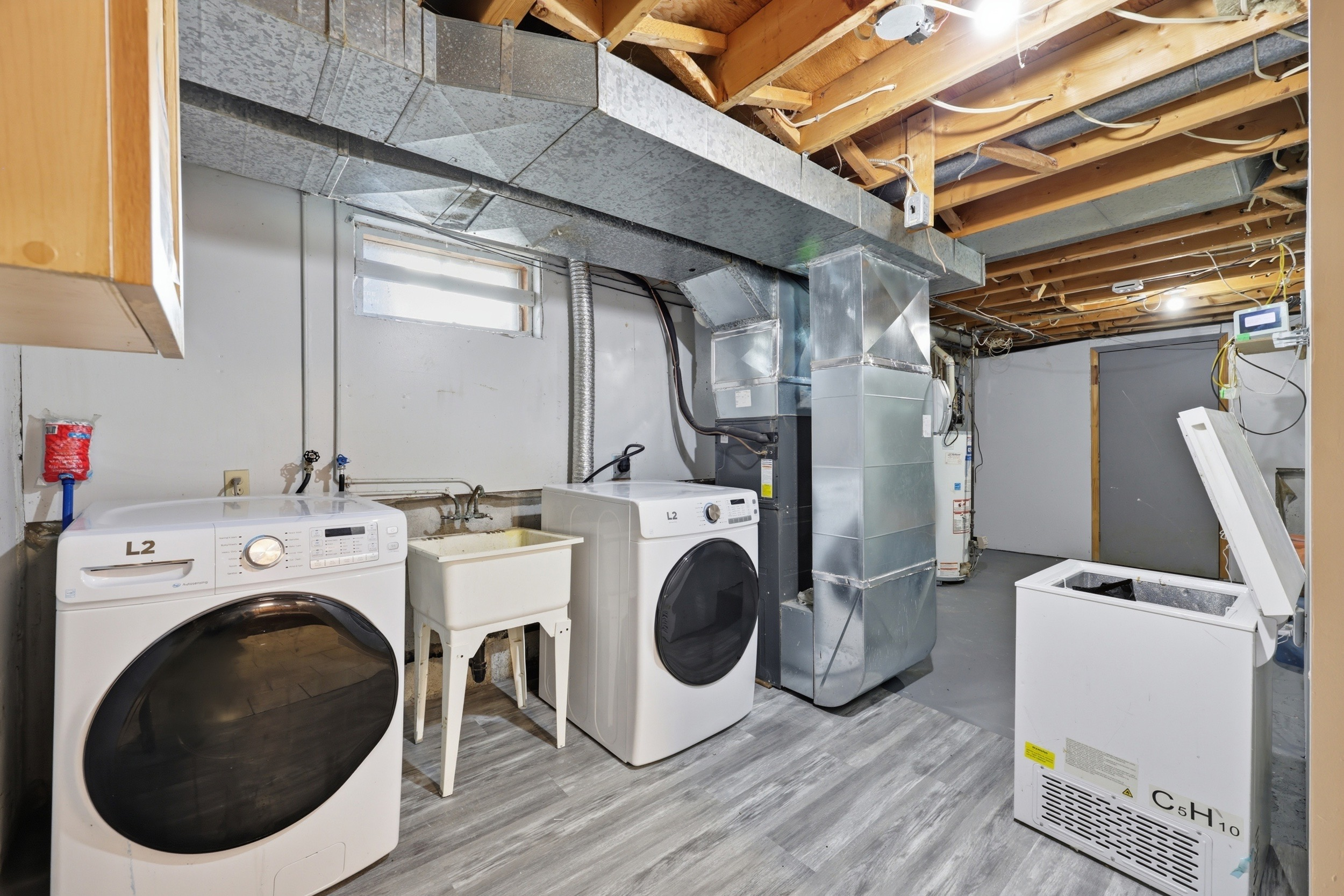 Utility and laundry room in basement
