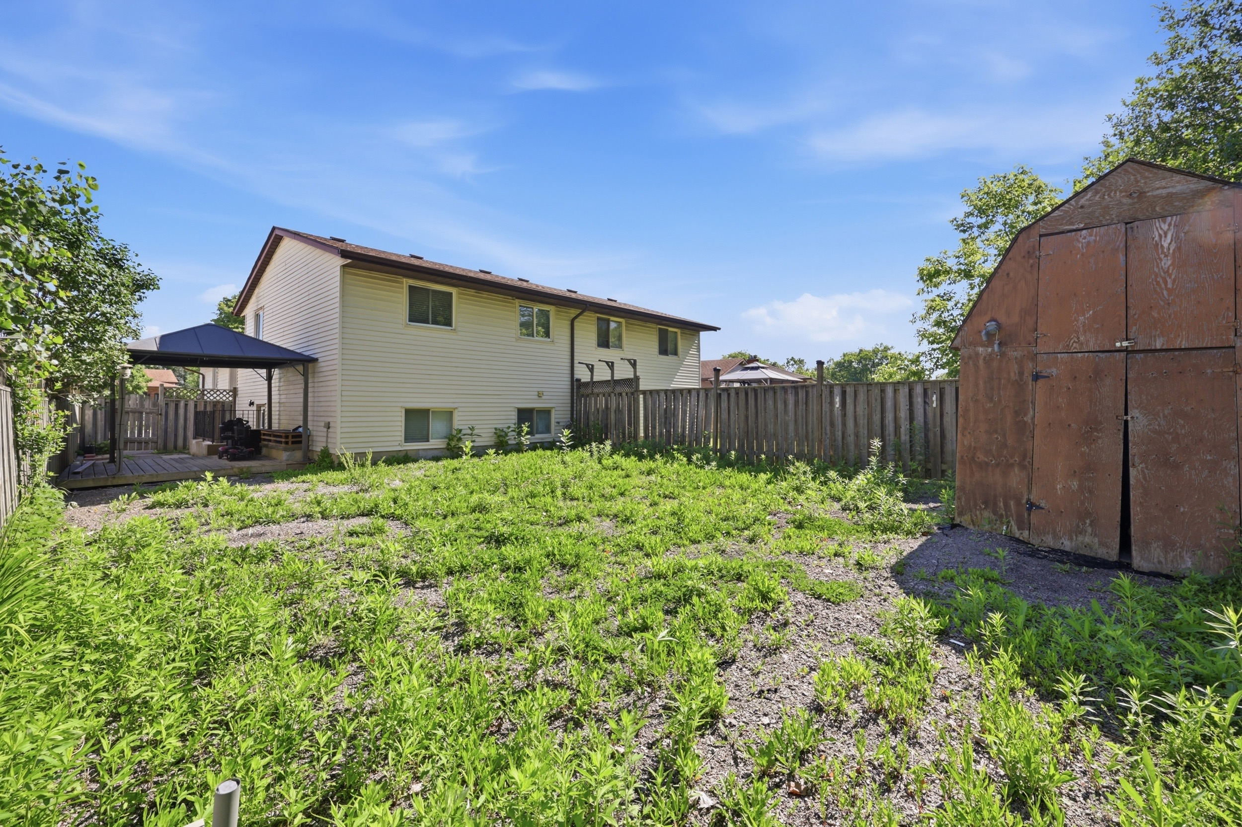 Rear backyard view toward the house