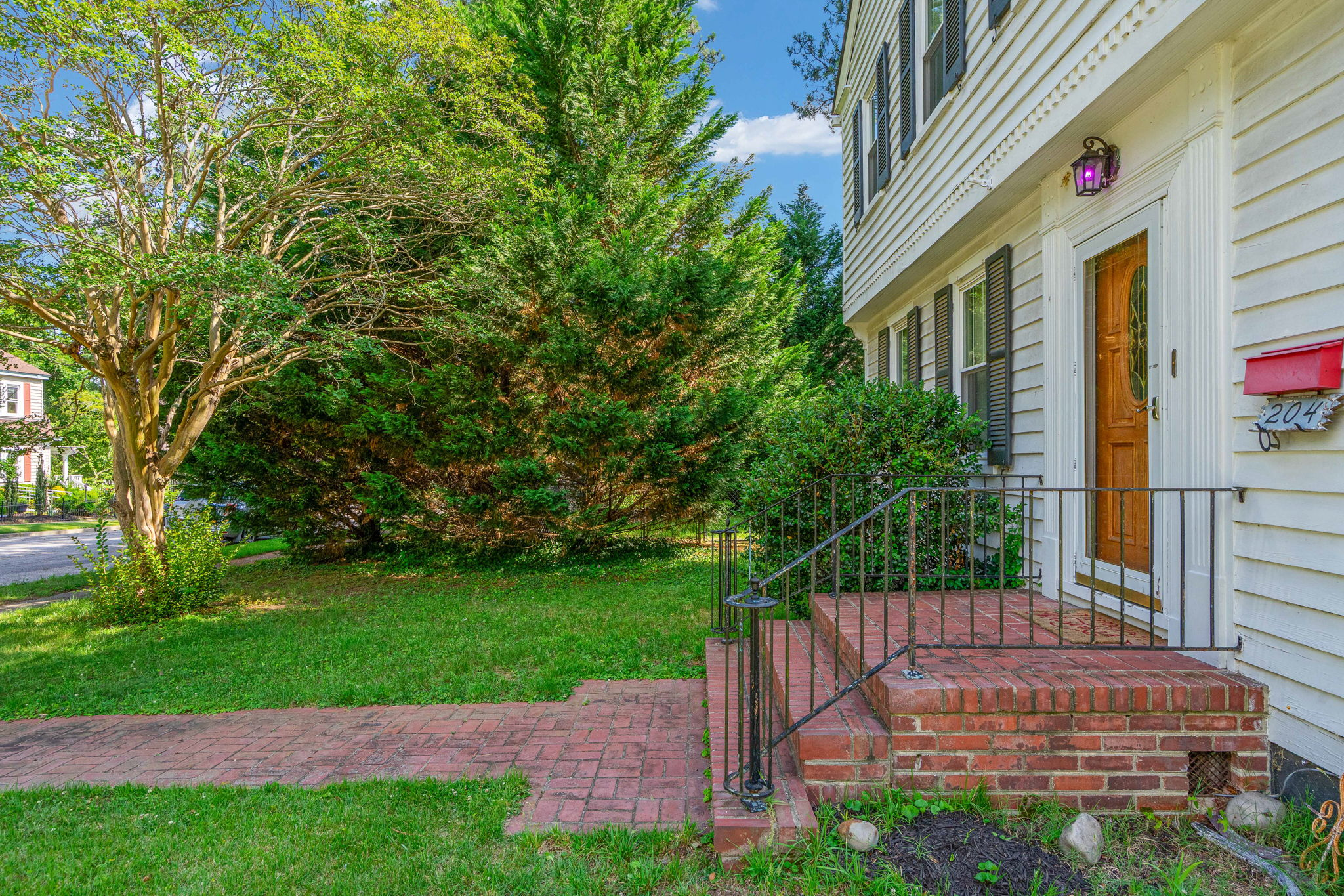 Front entry with wood door and glass insert