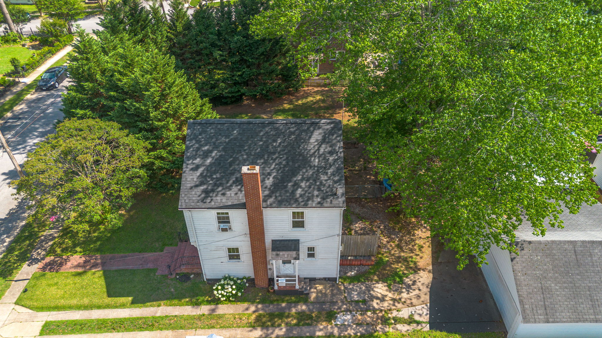 Aerial drone view of the home and surrounding neighborhood