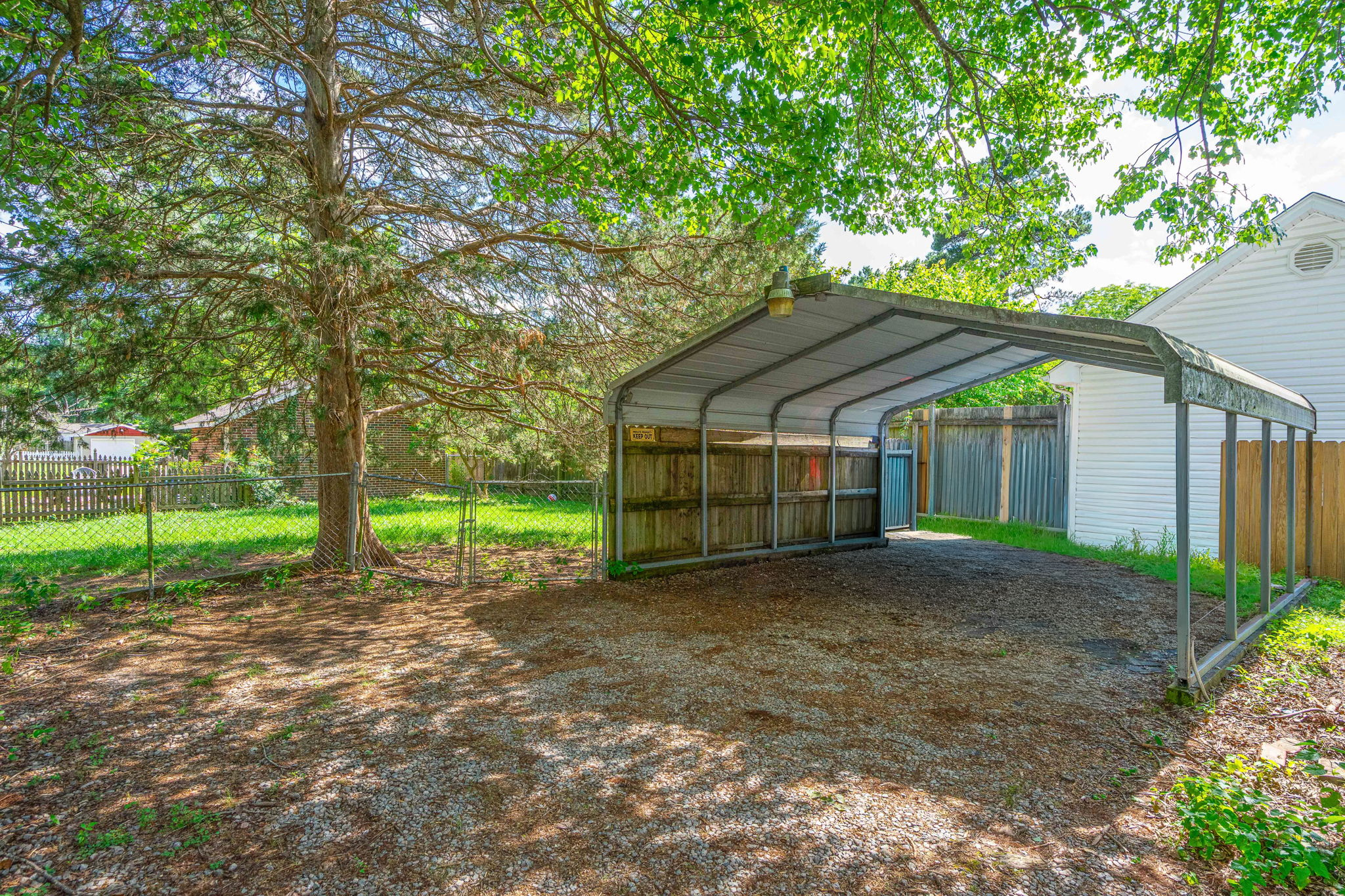 Metal carport structure in the backyard
