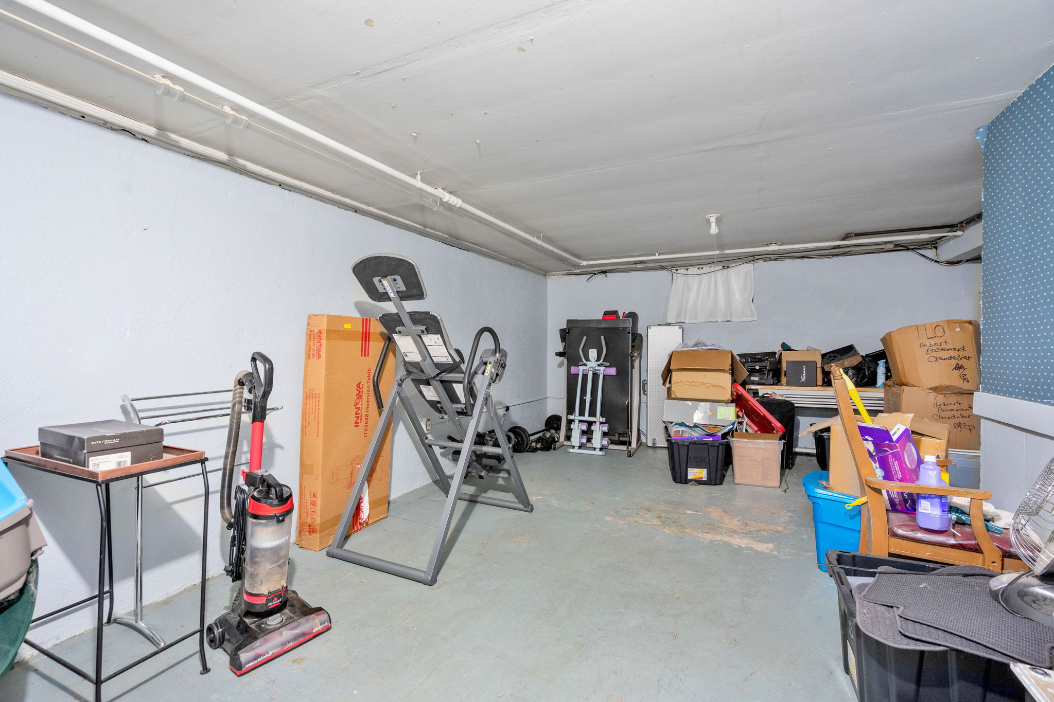 Basement utility area with storage space