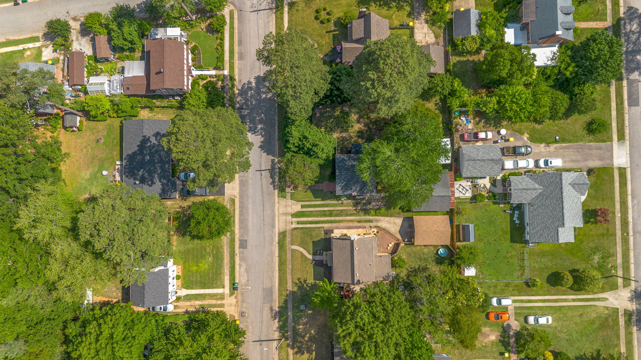 High-altitude aerial view of the residential area with tree canopy