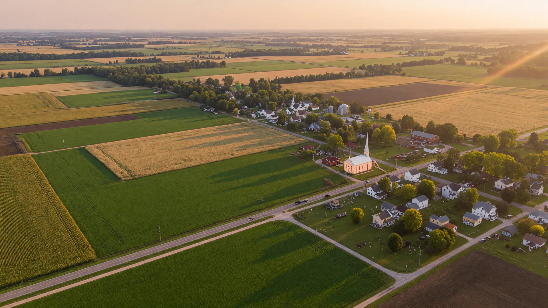 Charming small-town Main Street in rural Ohio with historic brick storefronts and autumn foliage