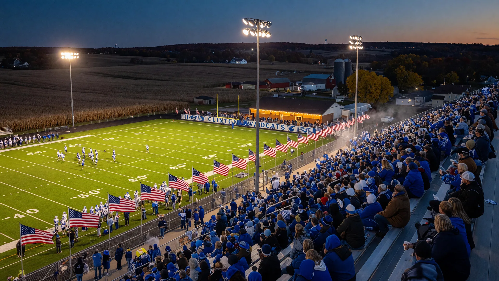 A small-town high school football stadium in Clinton County, Ohio filled with community members under Friday night lights