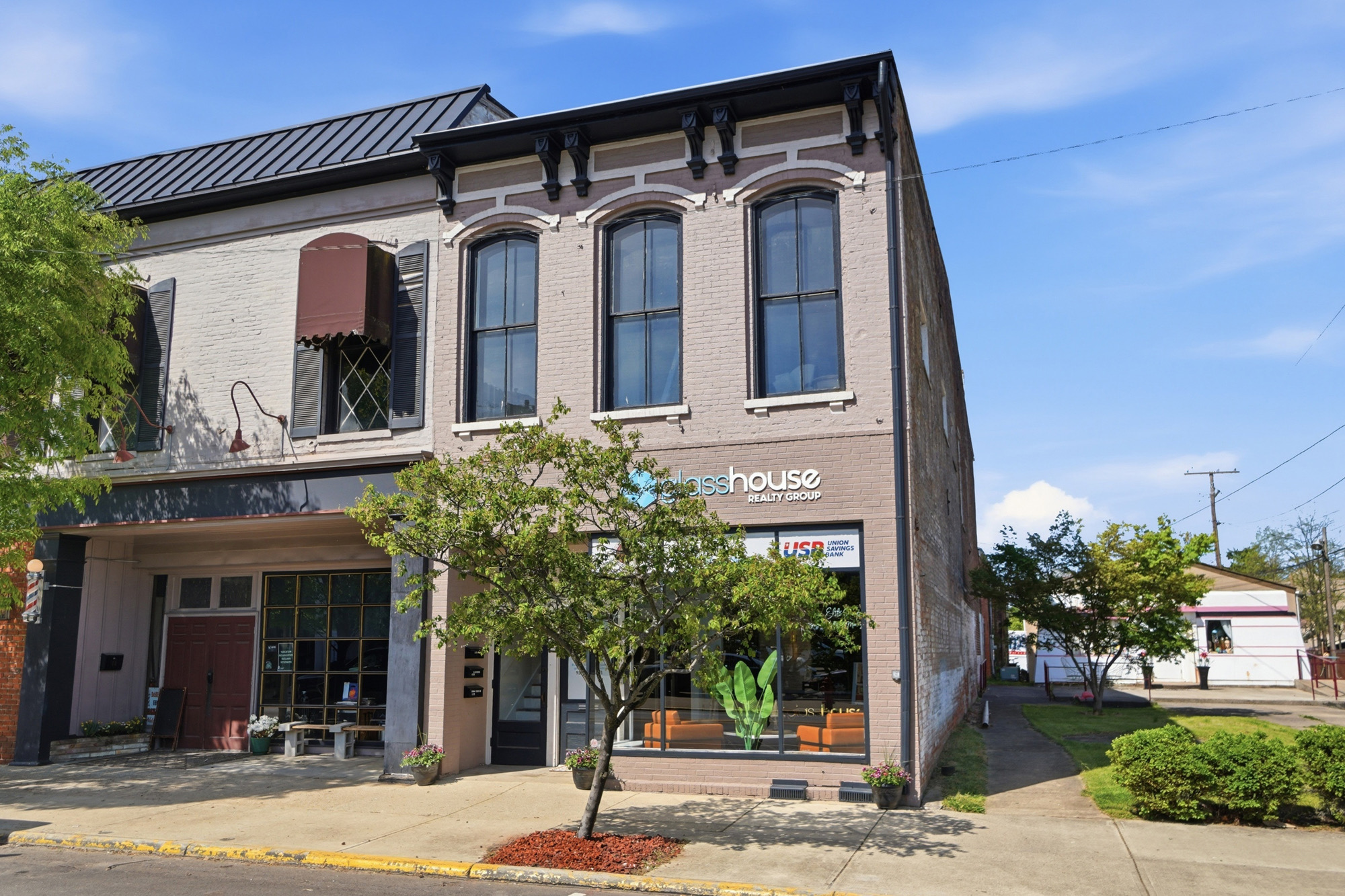 The Glasshouse Realty office — a historic brick building in downtown Wilmington, Ohio