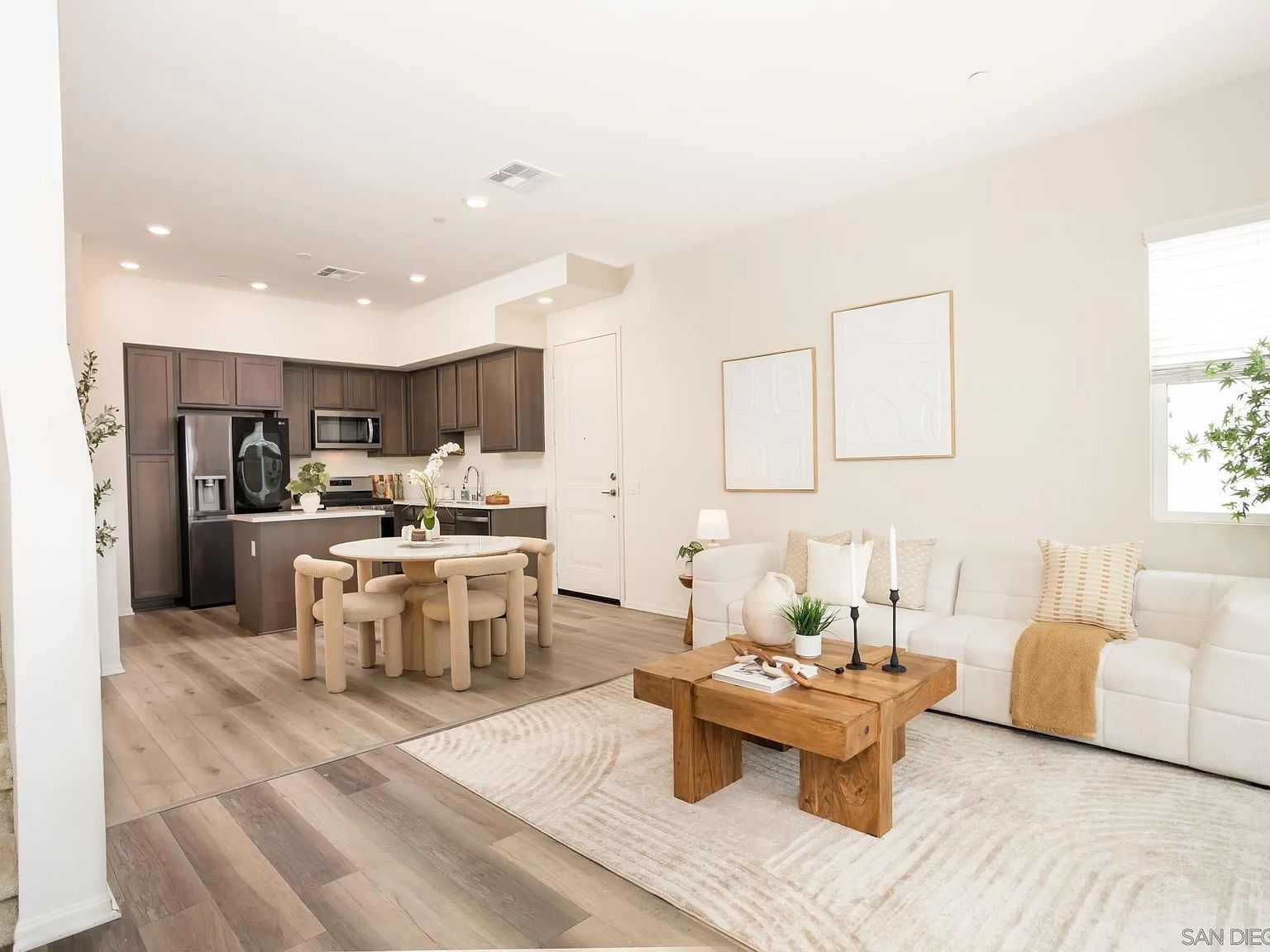 Open-concept living room flowing into the kitchen