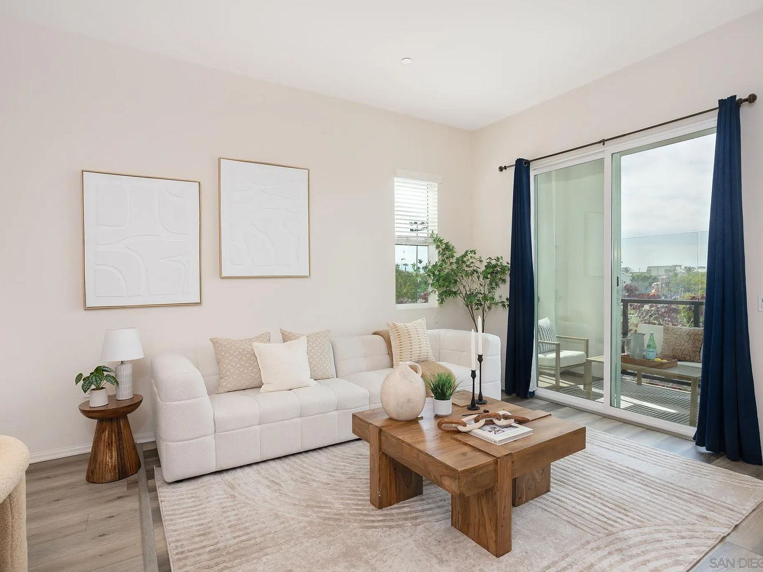 Living room with view to the attached balcony