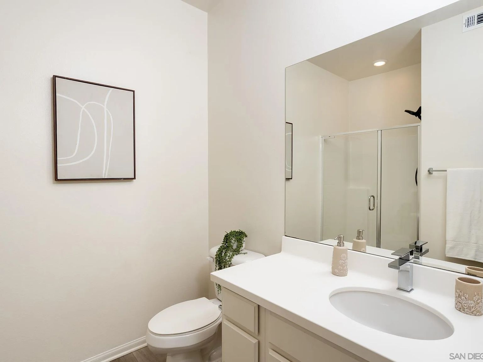 Bathroom with vanity and shower