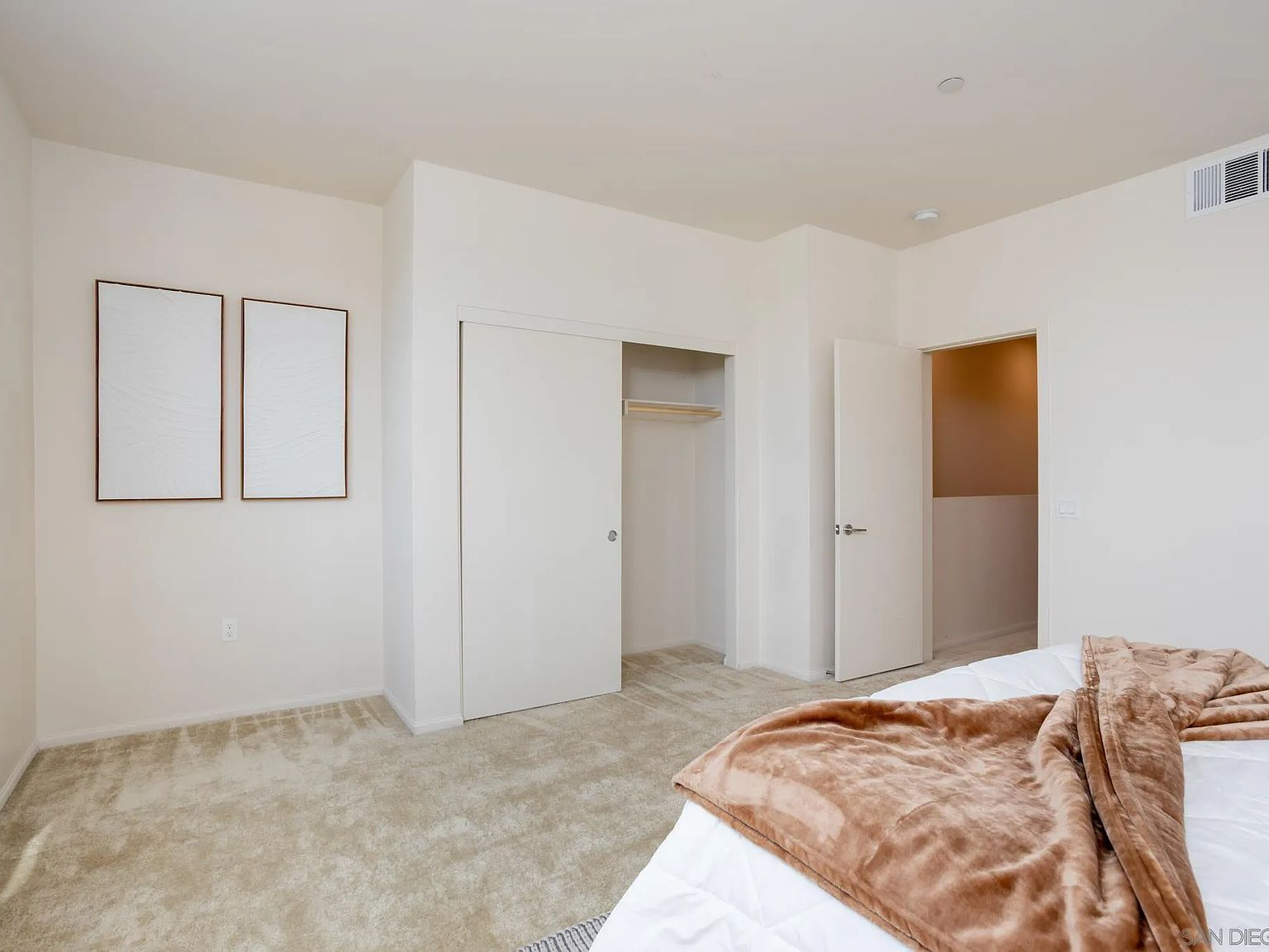 Secondary bedroom with closet
