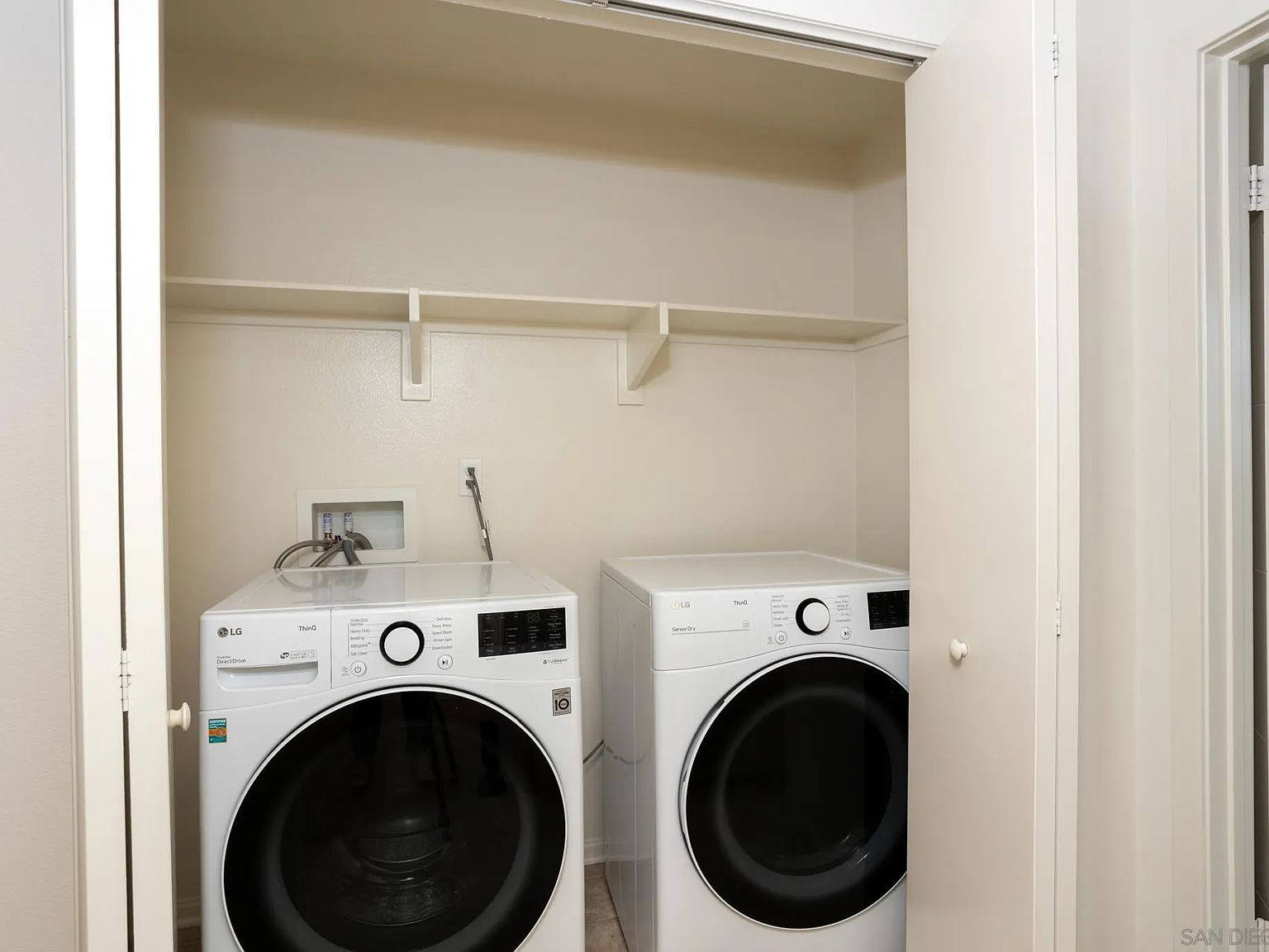 Laundry closet with washer and dryer