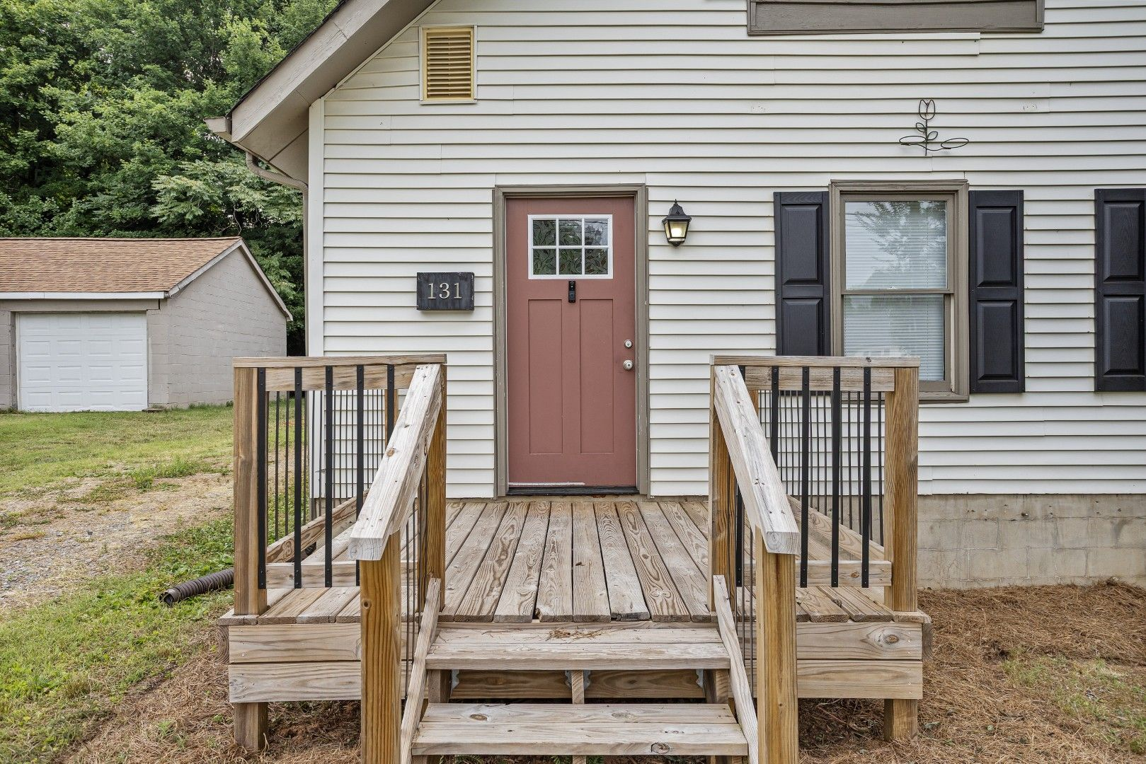 Close-up of updated front porch with new decking