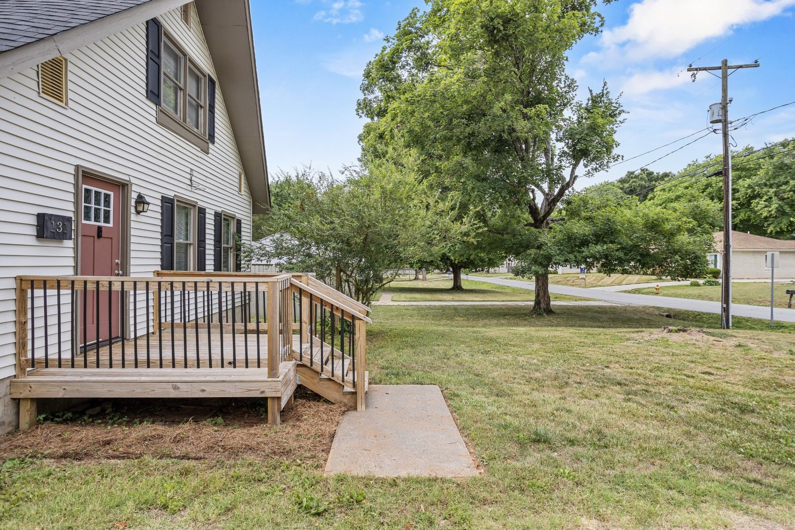 Street-level view showing new front porch deck