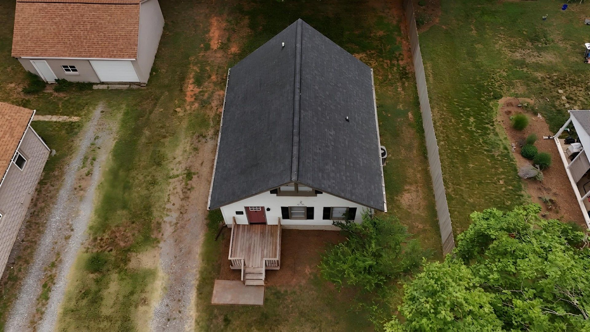 Overhead aerial of property showing detached shed and driveway